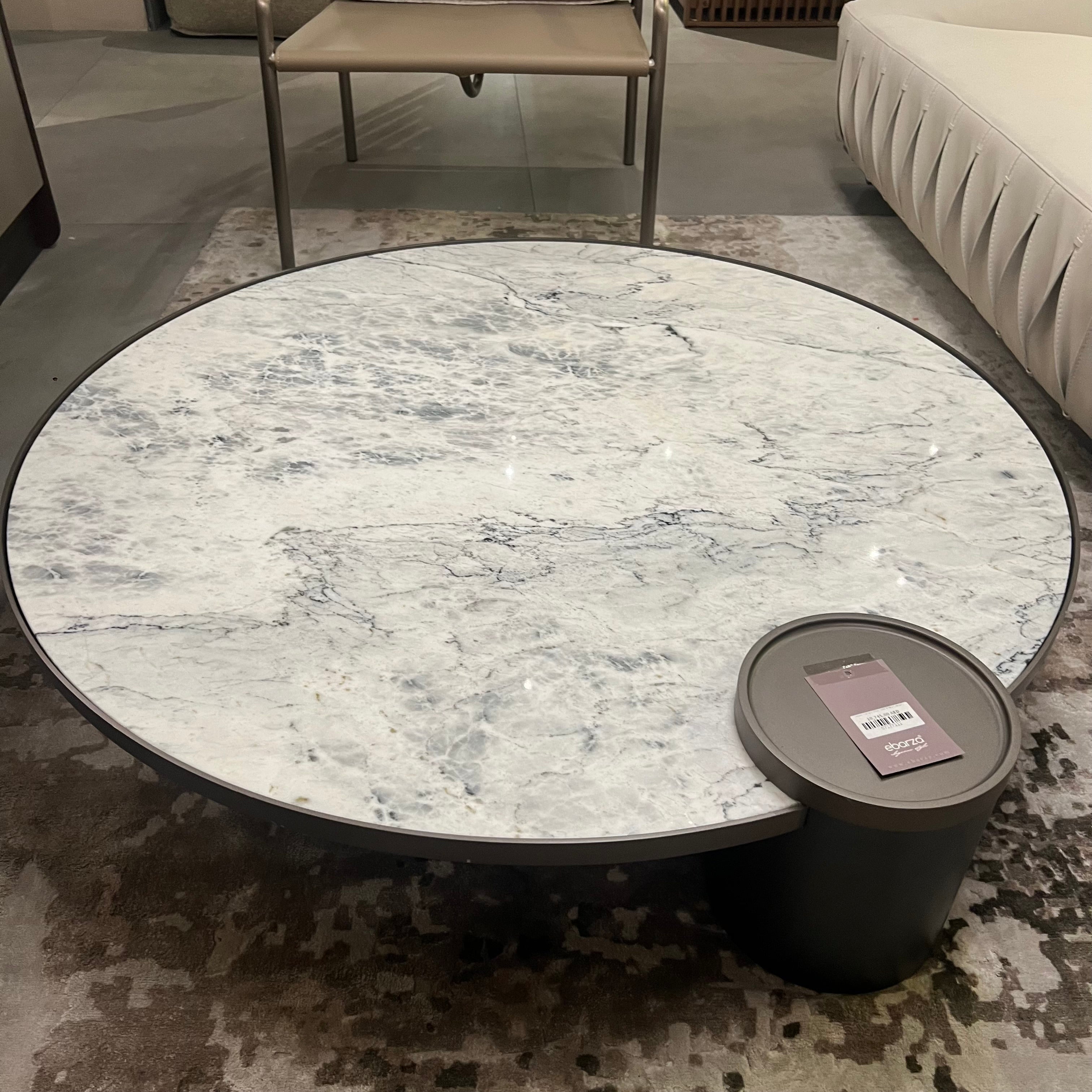 Desert marble coffee table by Beacon, modern display item with sleek surface and sturdy legs for stylish living room decor.