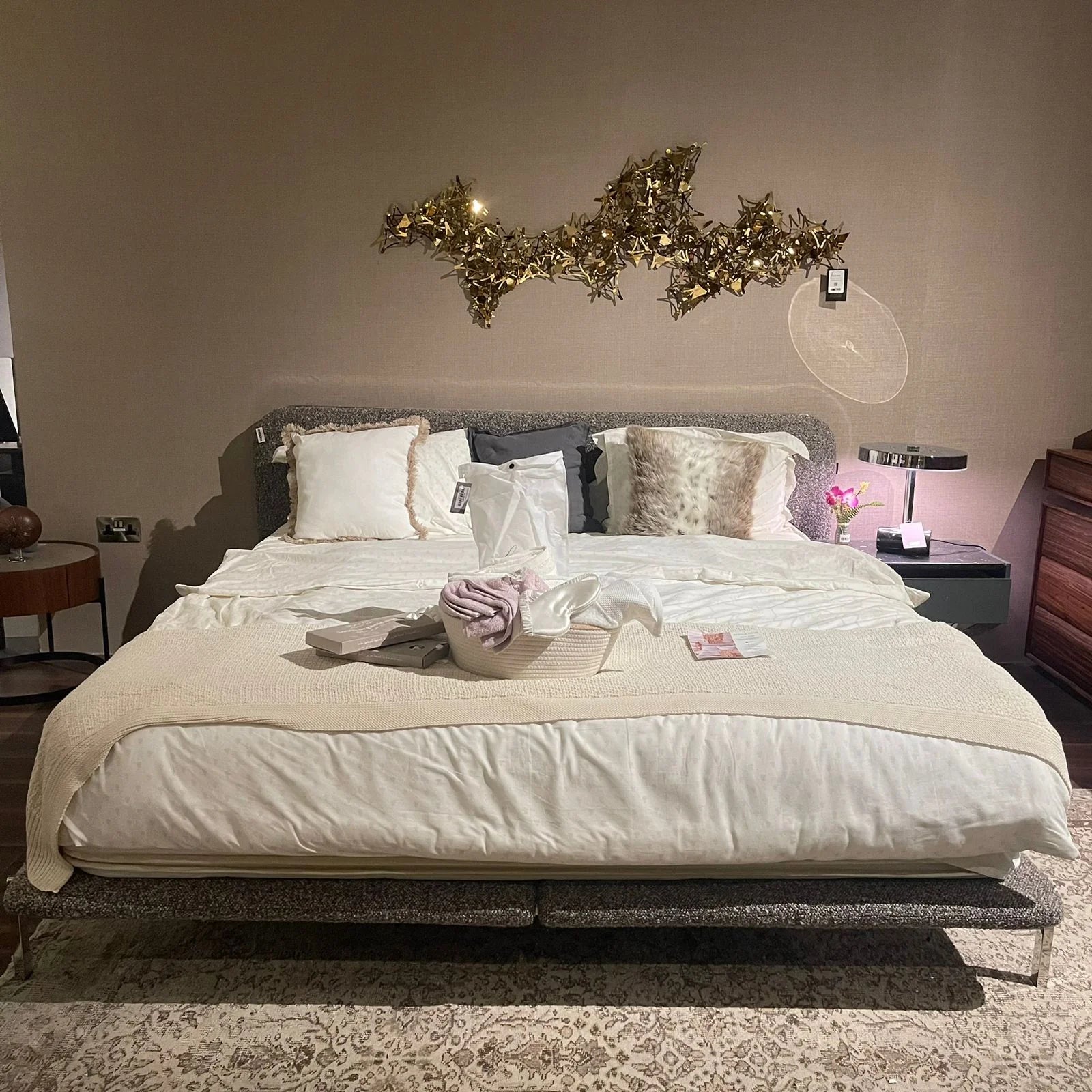 Display of the Duke King Size Bed by Beacon, showcasing the bed frame with a modern design and neutral upholstery.