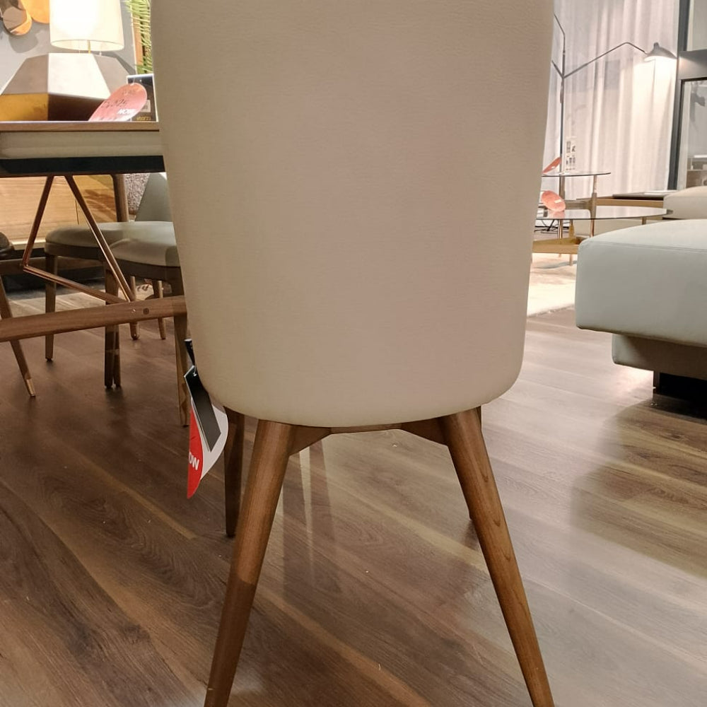 Display of Eco Nirvana Diva solid ash wood chair by Ozzo, showcasing its sleek design and natural wood finish.