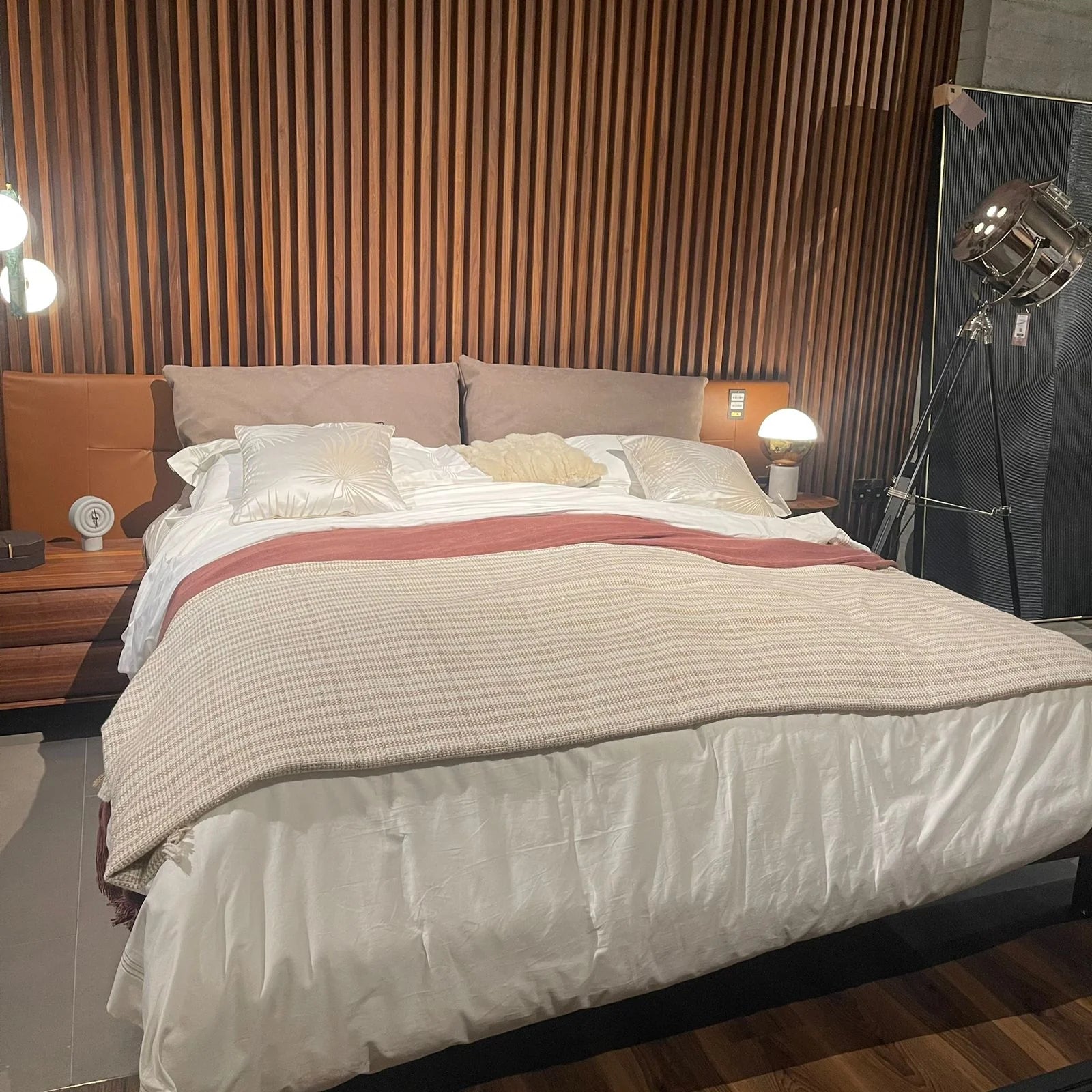 Display of the Era King Size Bedstead by Homage Koltuk, showcasing its elegant frame and design in a showroom setting.