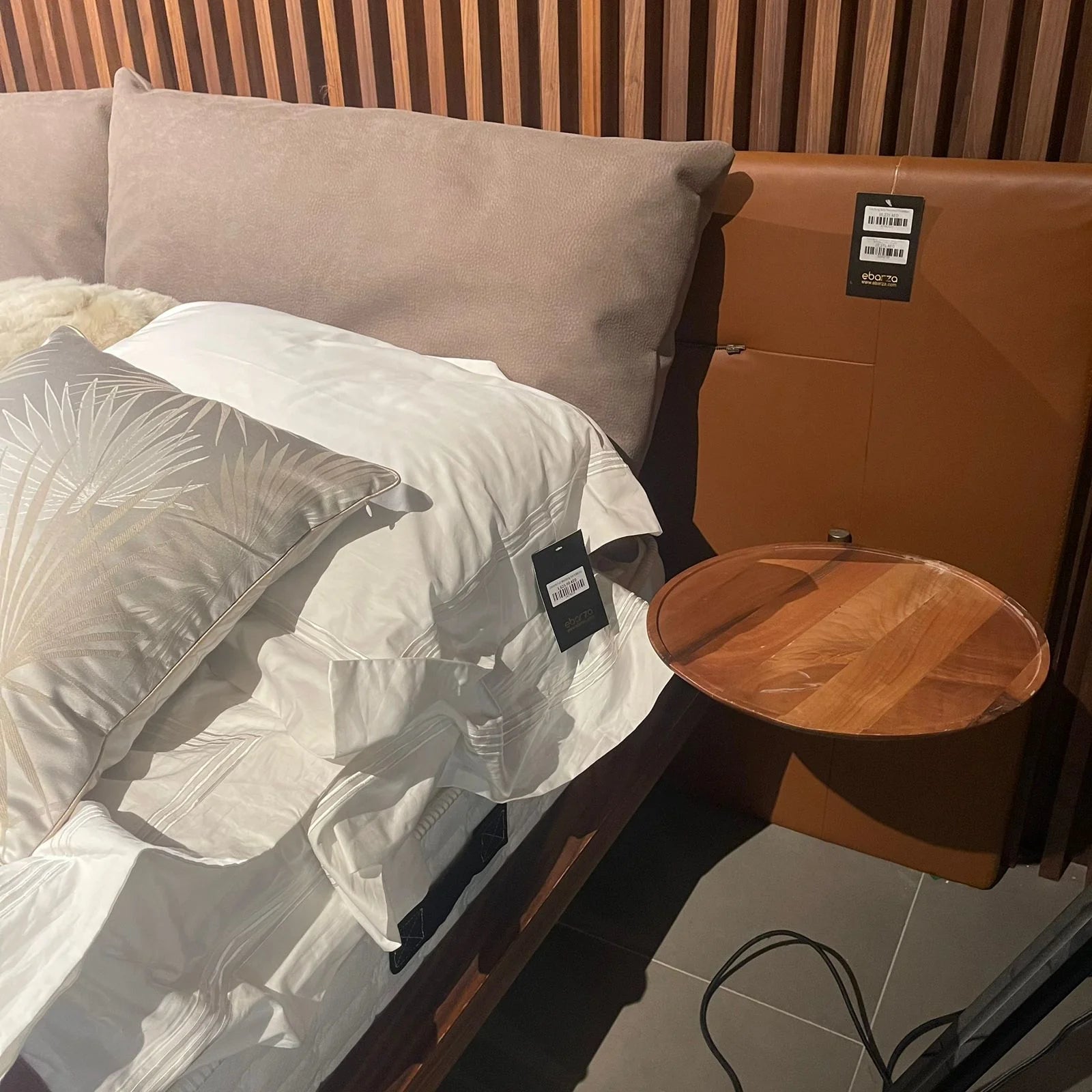 Display of Era King Size Bedstead by HOMAGE KOLTUK, showcasing the elegant wooden bed frame with a headboard and sturdy legs.