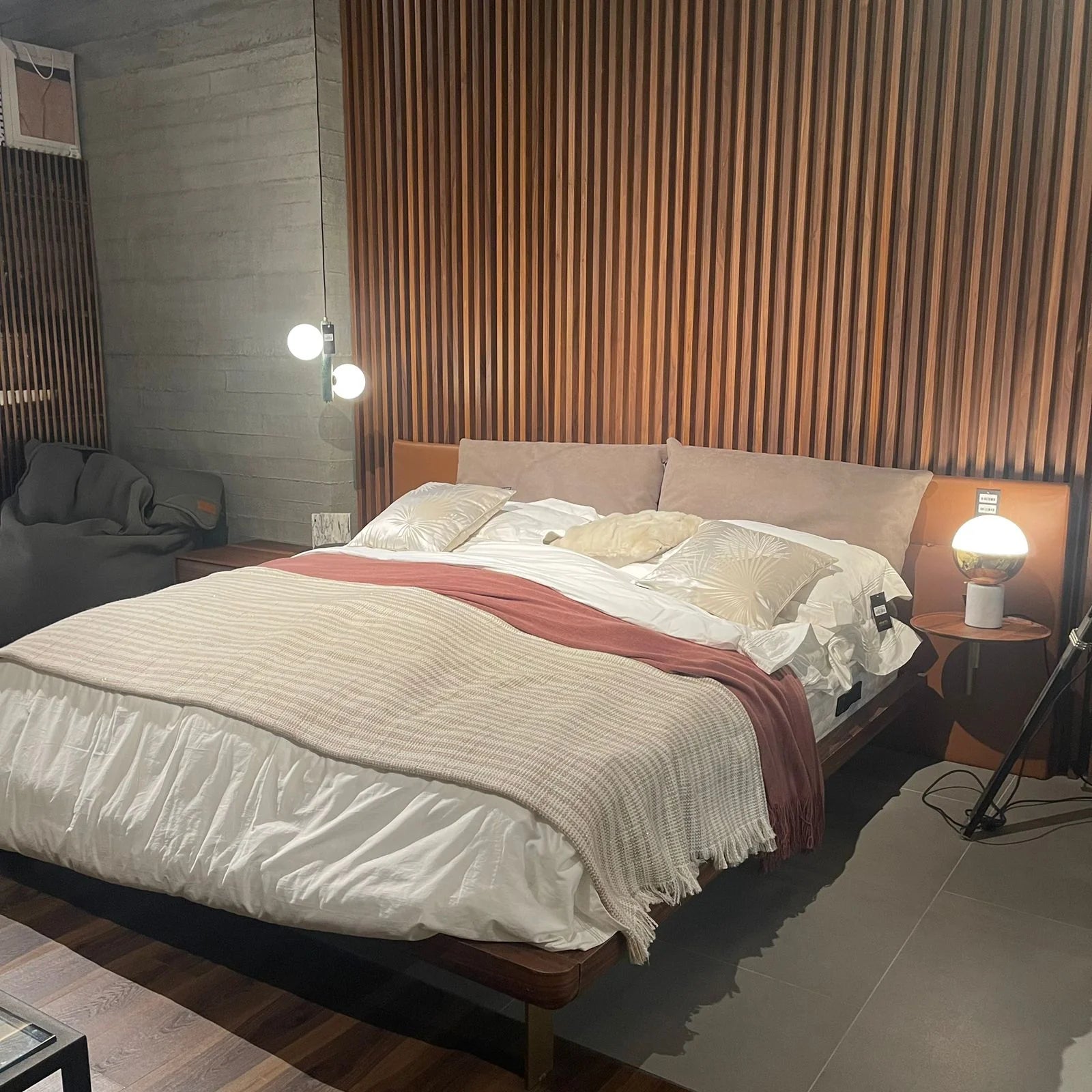 Display of Era King Size Bedstead by HOMAGE KOLTUK, showcasing the classic design and sturdy frame of the bed in a retail setting.