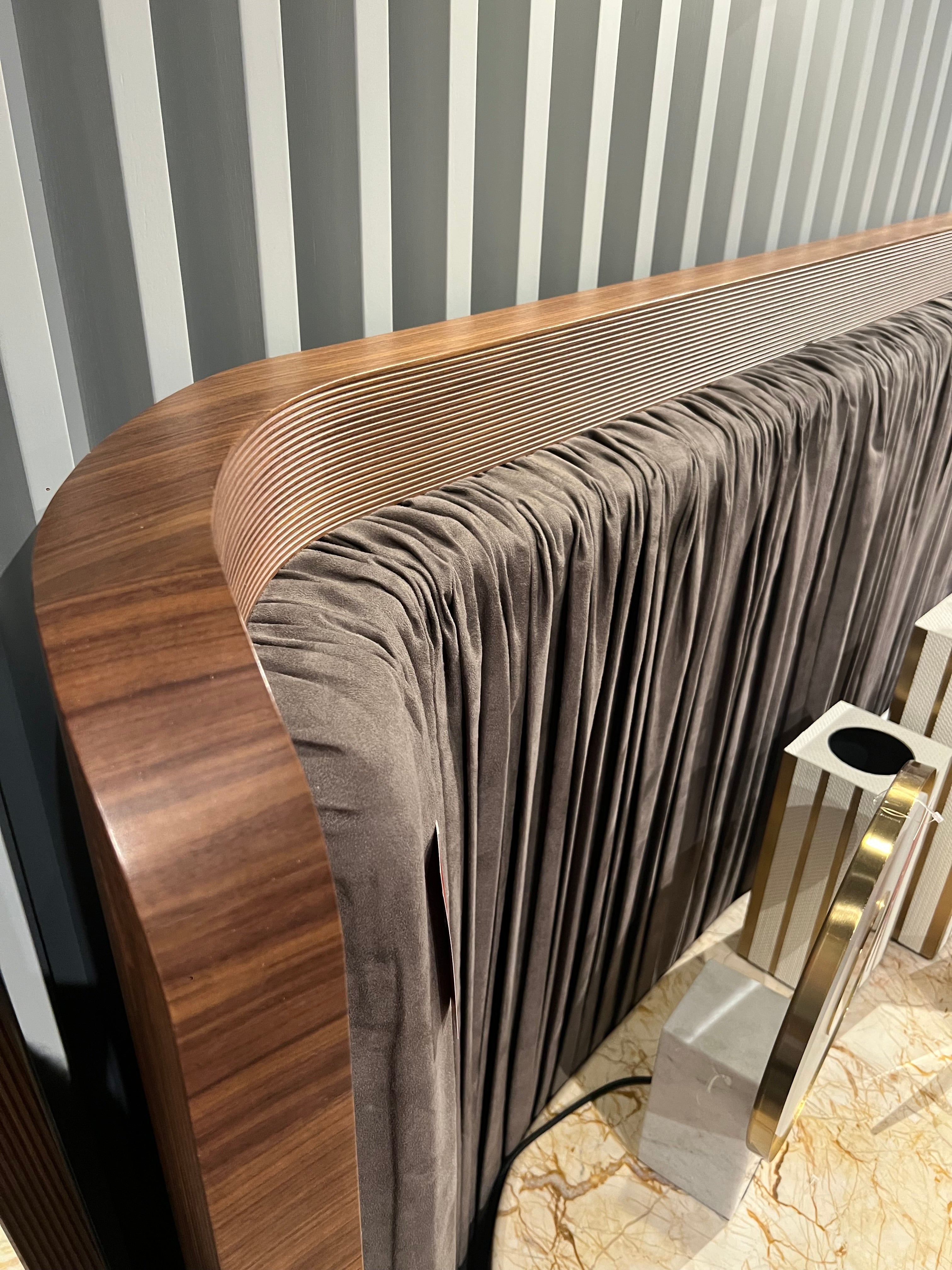 Display of Eva King Size Bedstead by LODA FURNITURE featuring a modern bed frame with a sleek headboard and wooden finish.