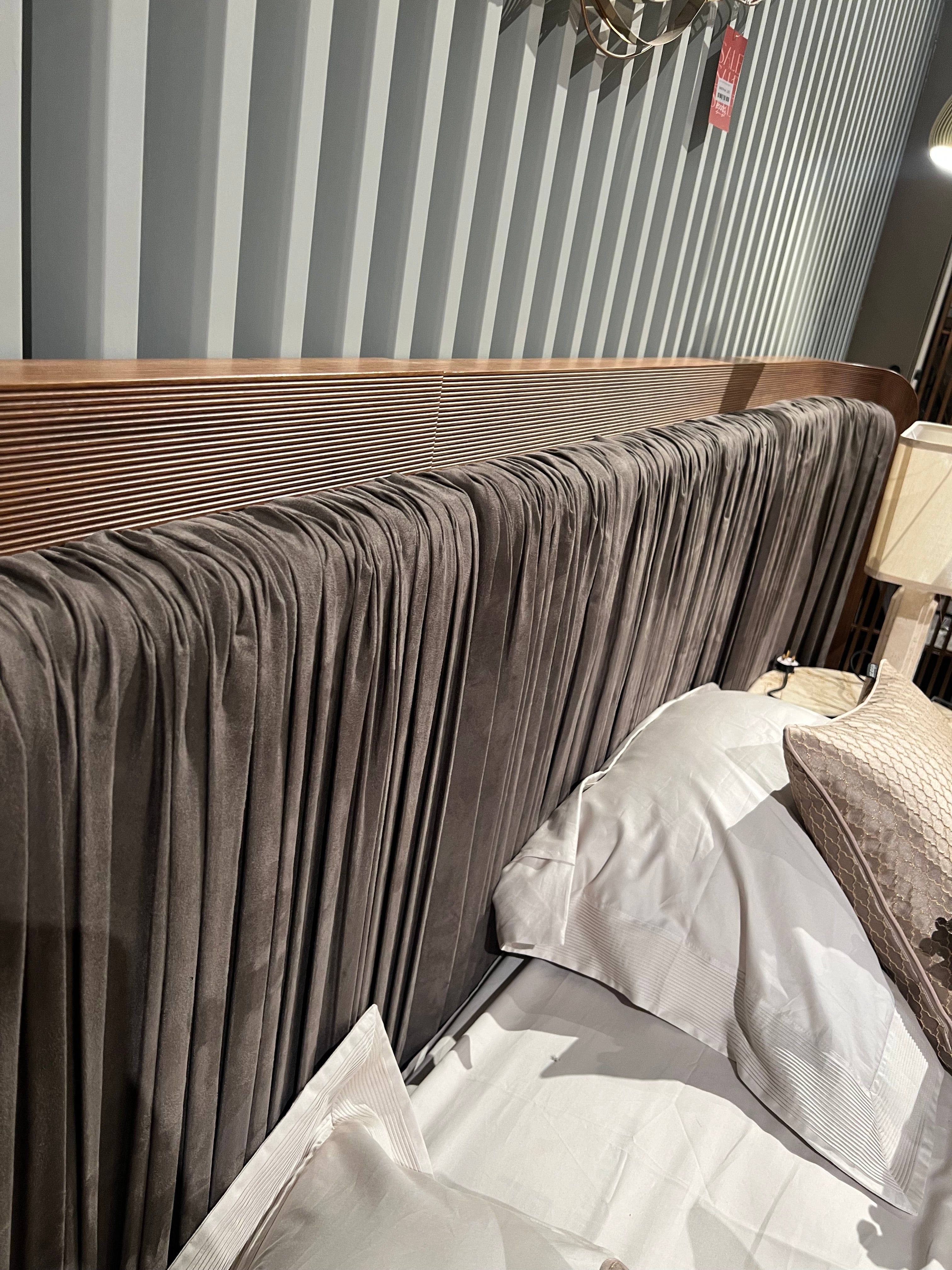 Eva King Size Bedstead by LODA Furniture, Nakheel style, displayed as a showroom model with modern wooden frame and sleek design.