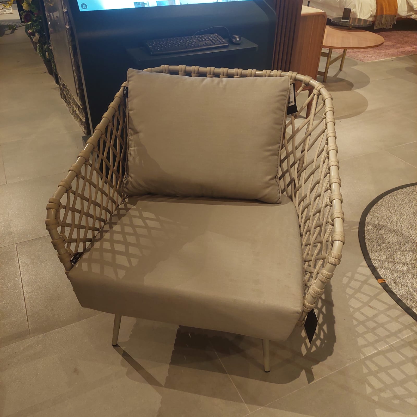 Display of the BEACON Evolve outdoor armchair, showcasing its modern design and outdoor-friendly materials.