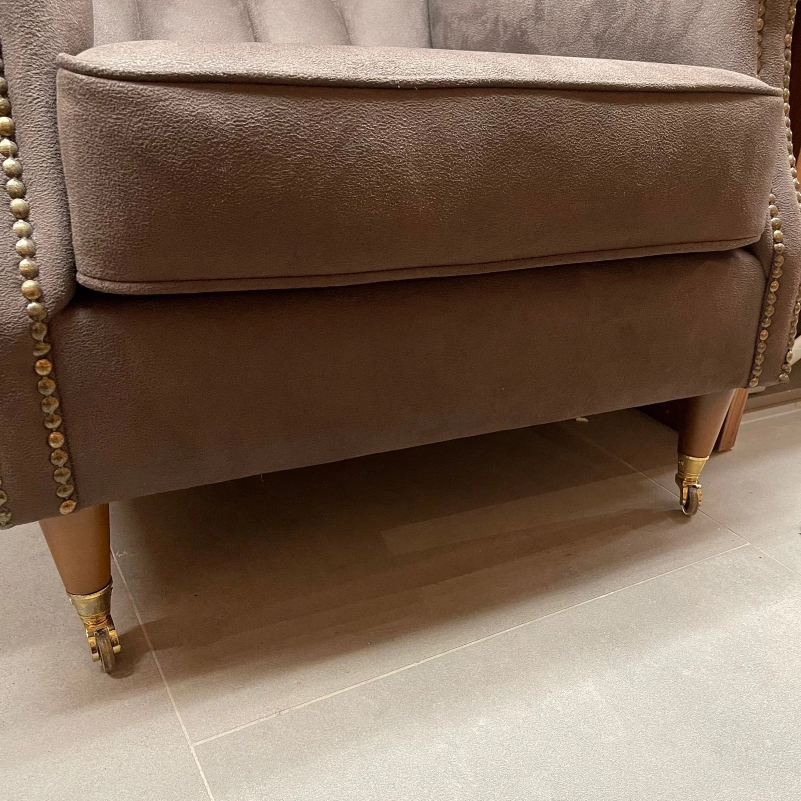 Fashion112 armchair by NDESIGN, stylish display piece with a modern design, showcased on a neutral background.