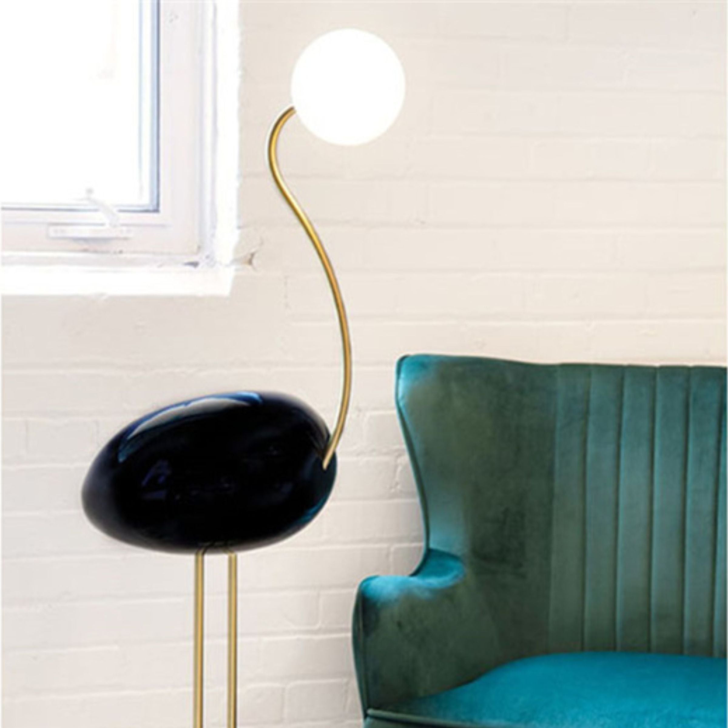 Black Flamingo Floor Lamp by BEACON, featuring a modern design with a sleek black finish, ideal for contemporary living spaces.
