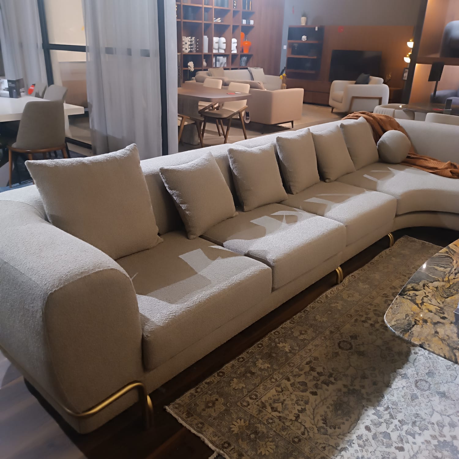 Display of Giallo L Shape Sofa Gialo-062YAS by LODA FURNITURE, showcasing the modern yellow sectional sofa in a retail setting.