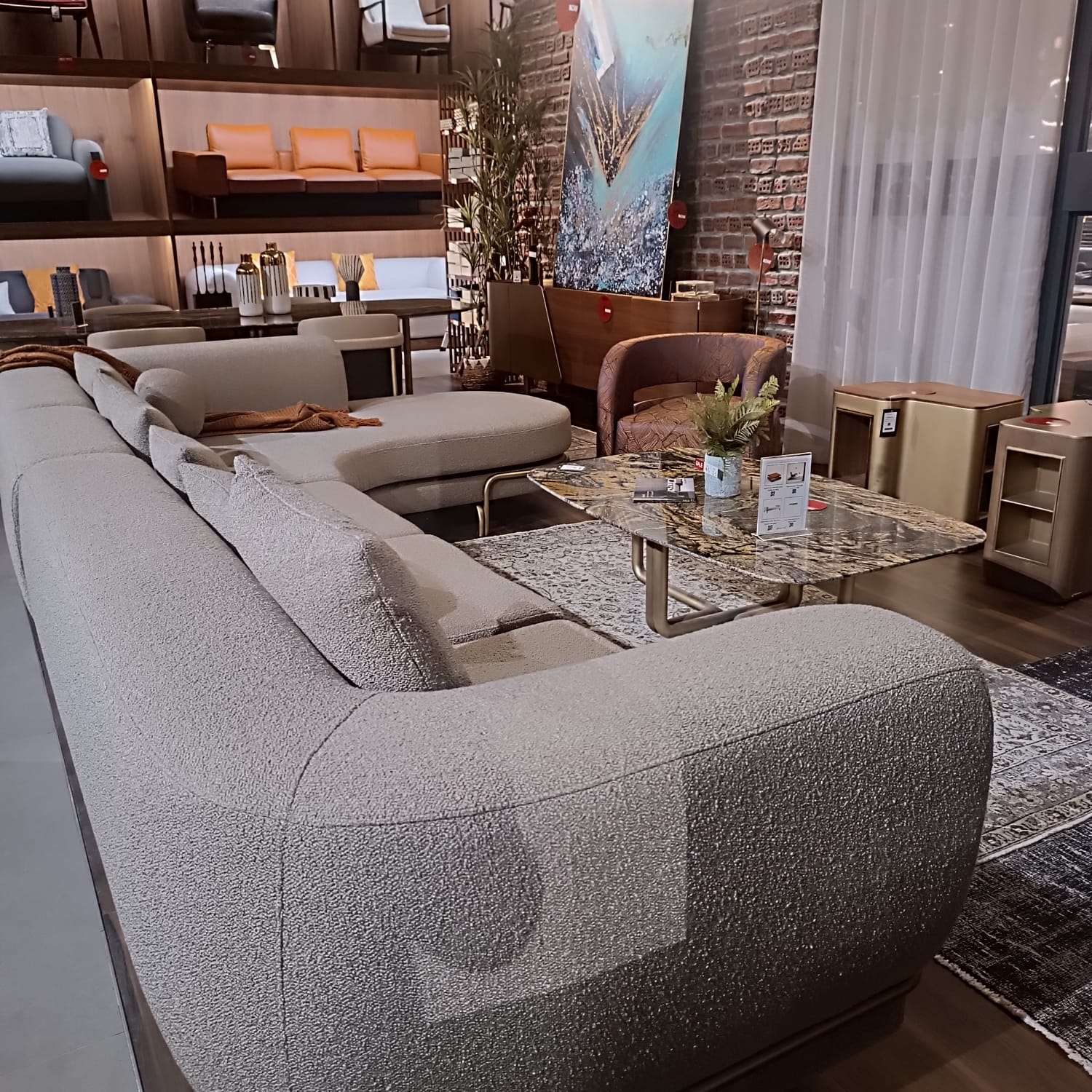 Giallo L-shaped sofa display item by Loda Furniture, showcasing modern yellow fabric upholstery and sleek design.
