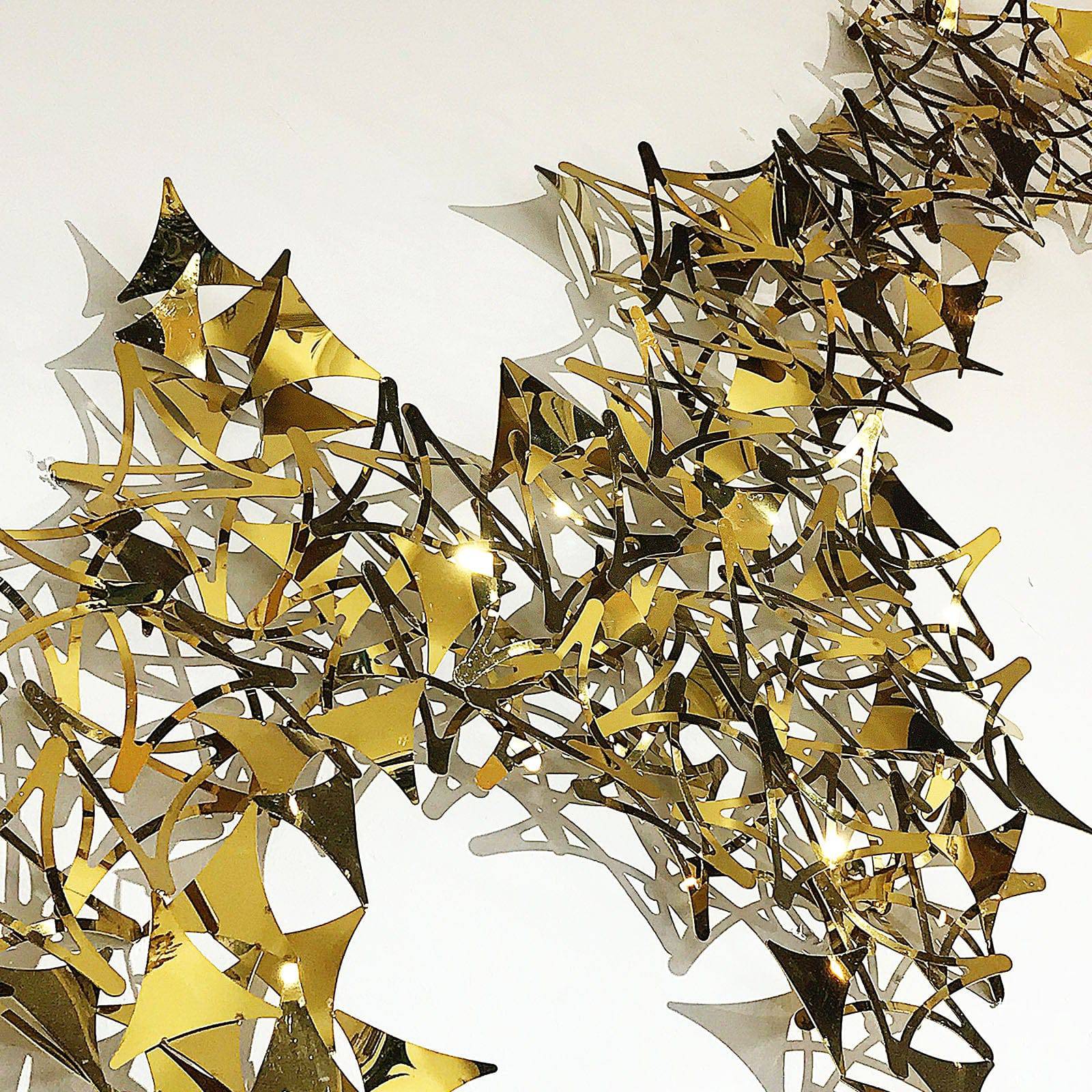 Golden stars handcrafted stainless steel artwork display item by Beacon, with intricate star patterns and metallic finish.