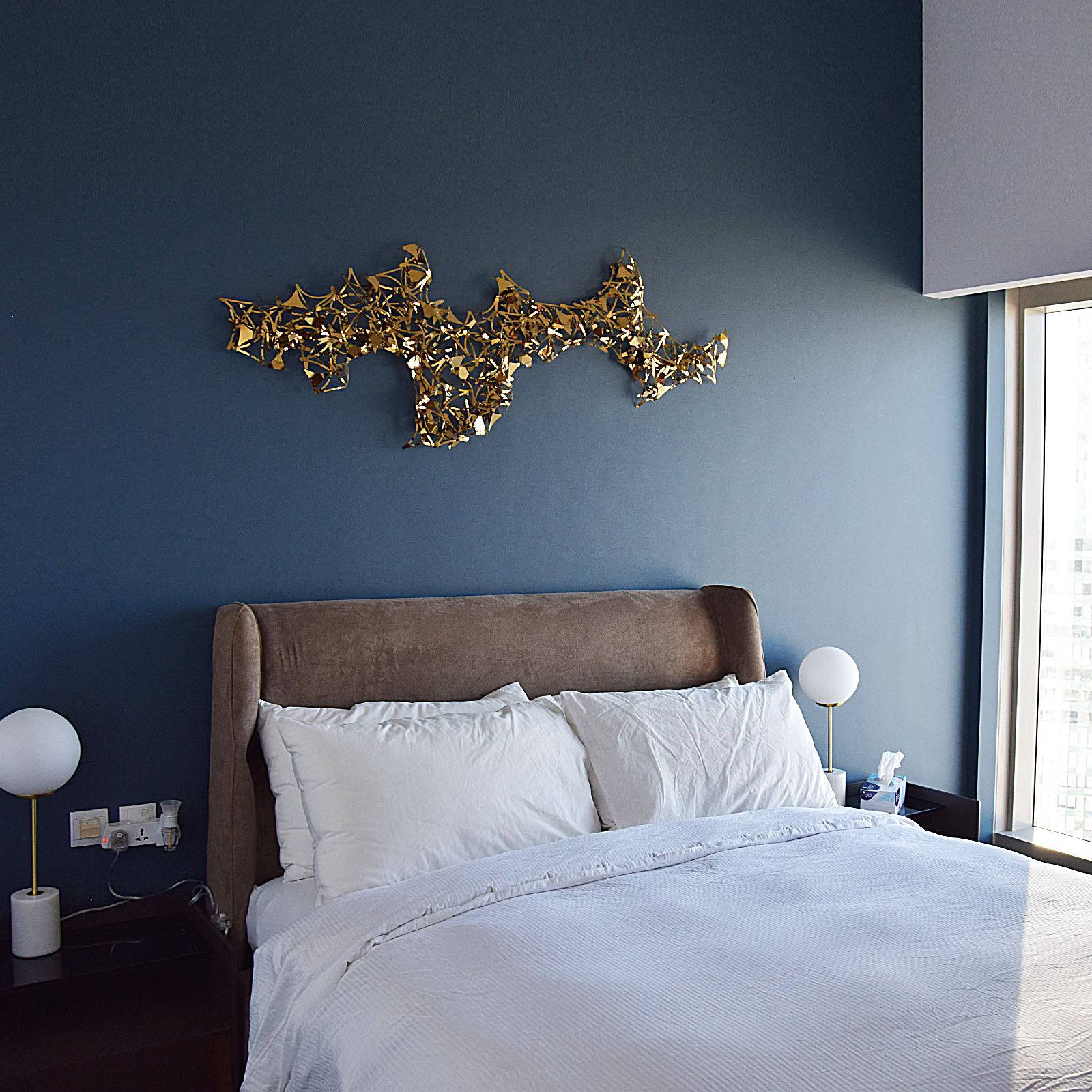 Golden stars handcrafted stainless steel artwork display item by Beacon, showcasing intricate metallic star design.