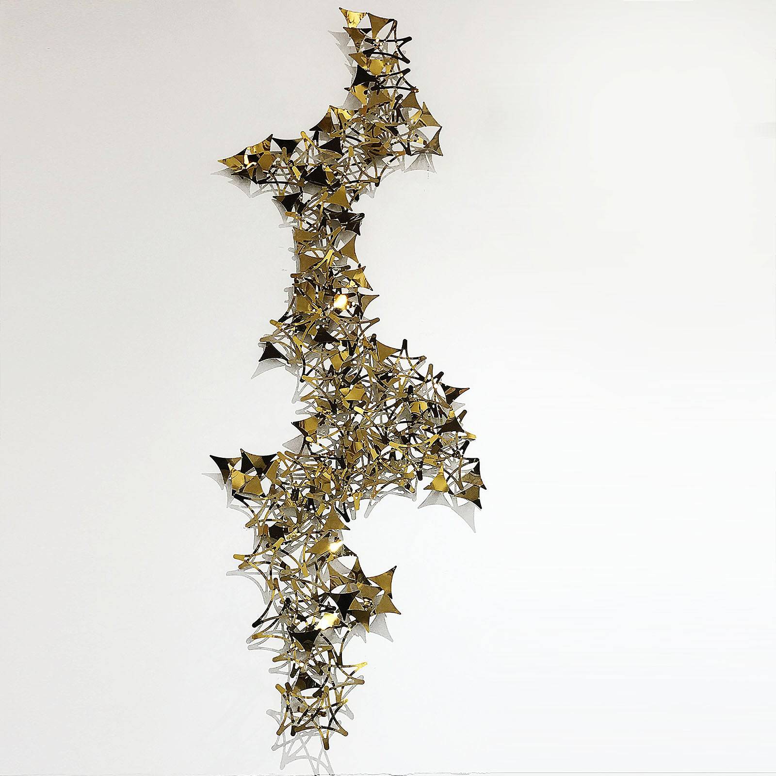 Golden stars handcrafted stainless steel artwork display item by Beacon, featuring intricate design and metallic finish.