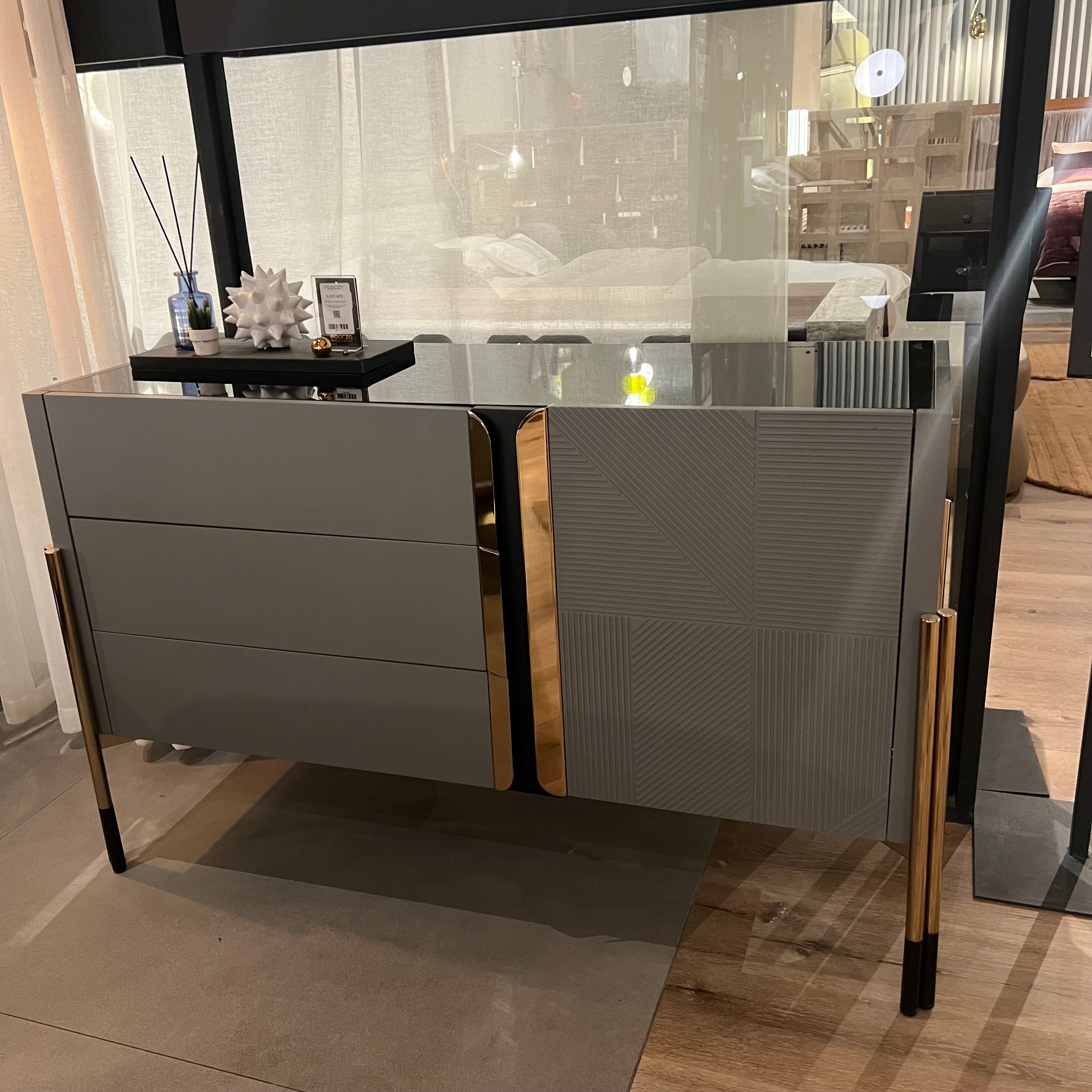 Grey dresser and mirror by Yol Living, featuring a modern design, displayed with the dresser and matching mirror in a contemporary setting.