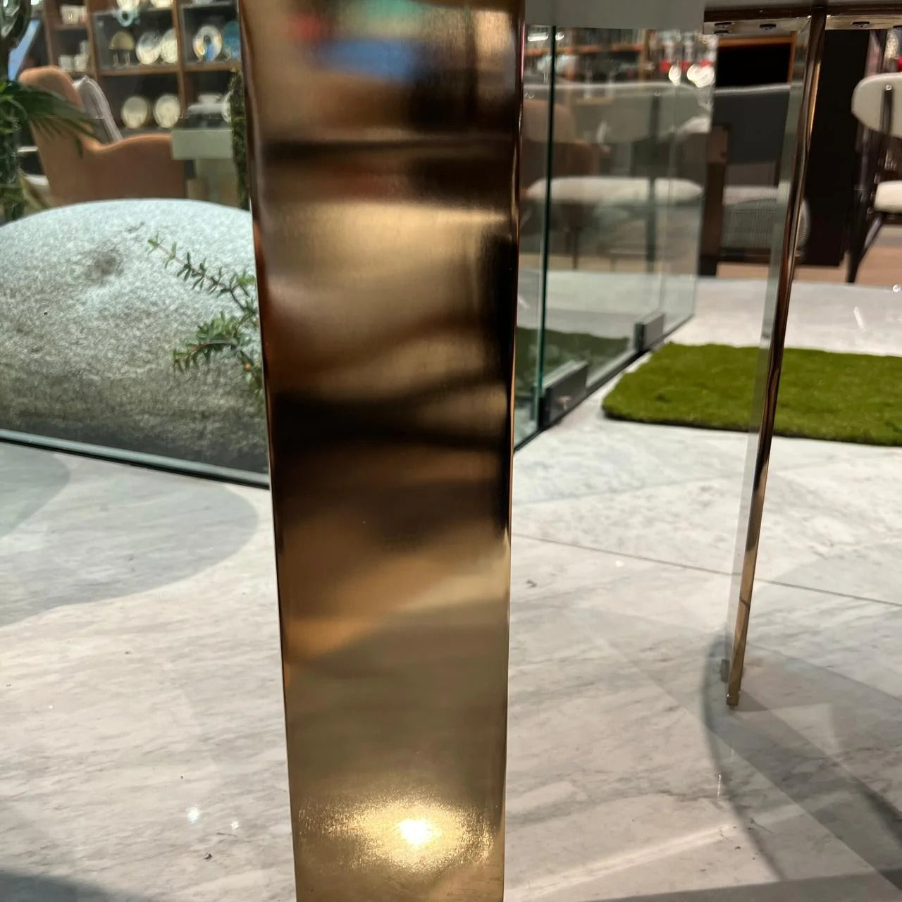 Heritage side table by Saloni, modern wooden display piece with sleek design, shown as a display item in a showroom setting.