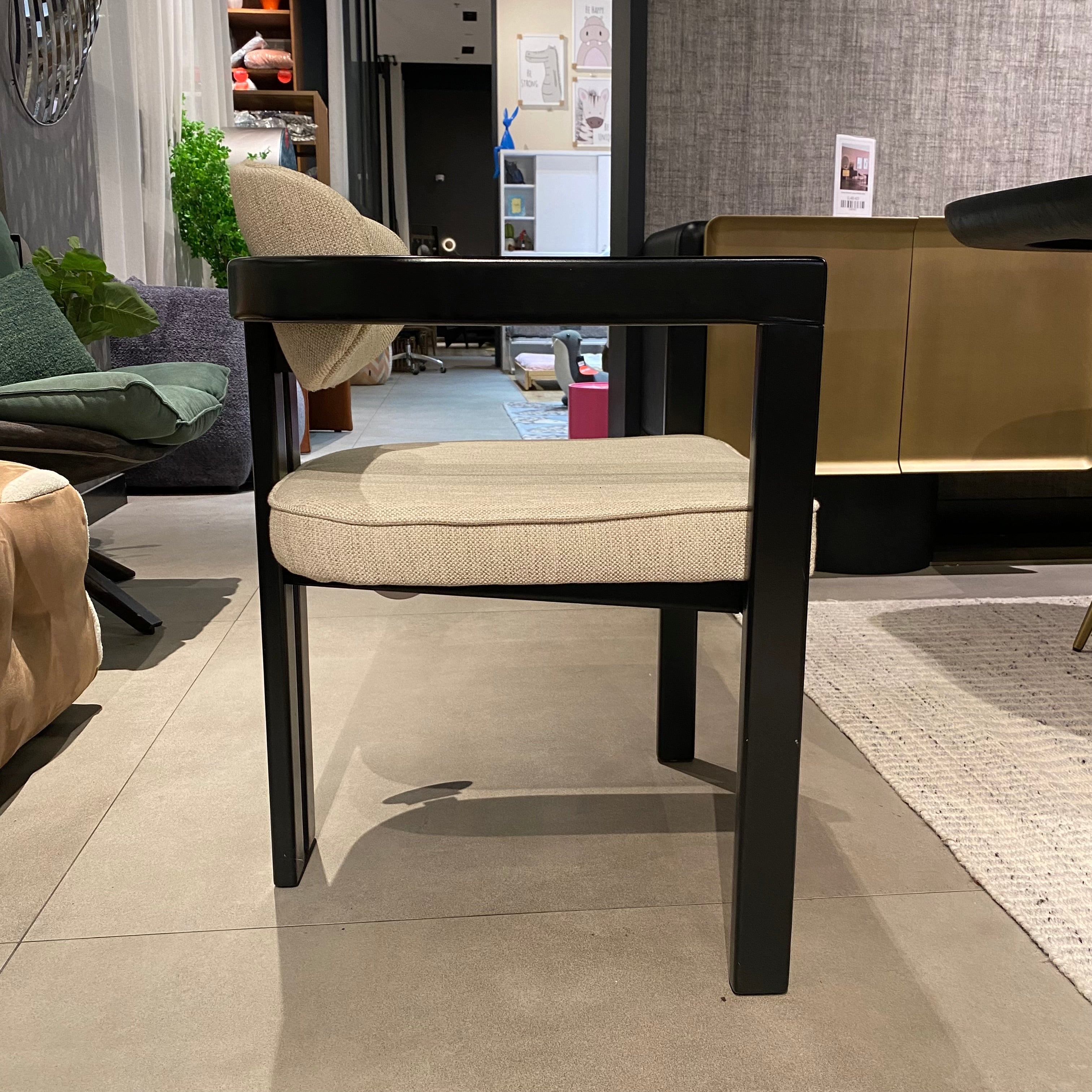 Display image of a Kotor Notte chair by SANCREA, showcasing modern design with sleek black upholstery and sturdy frame.