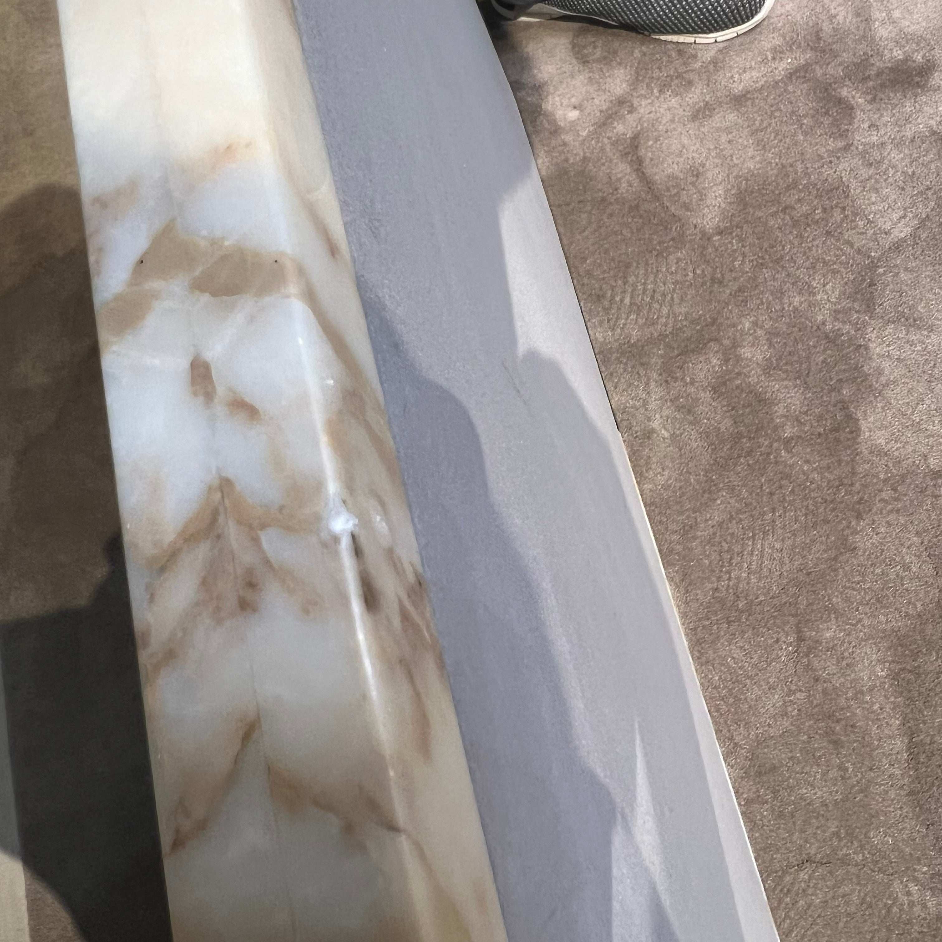 Black and gold Lauren coffee table by Beacon with modern design, featuring a sleek surface and stylish metallic accents.