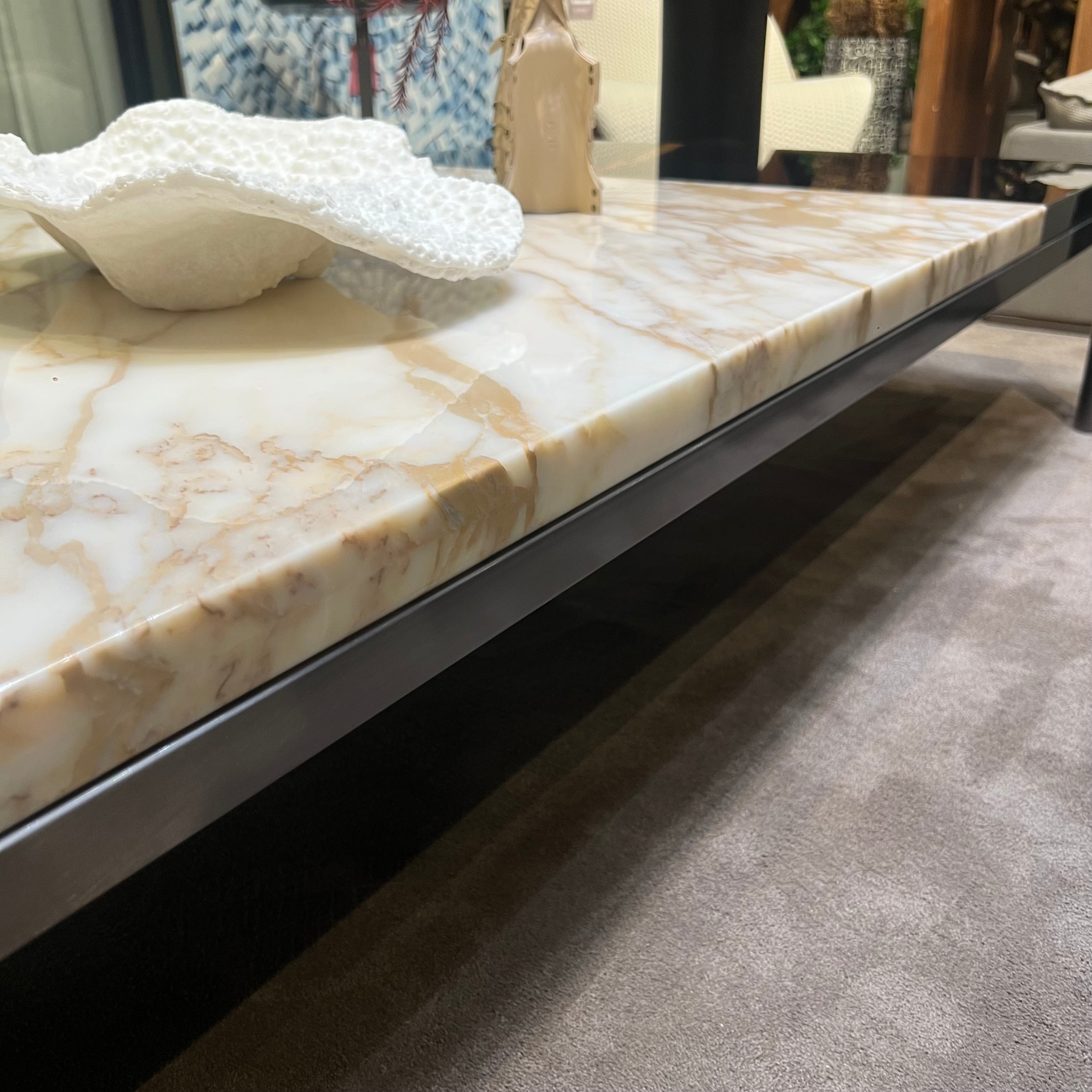 Black and gold Lauren coffee table by Beacon with sleek design, displayed on a modern living room setting.