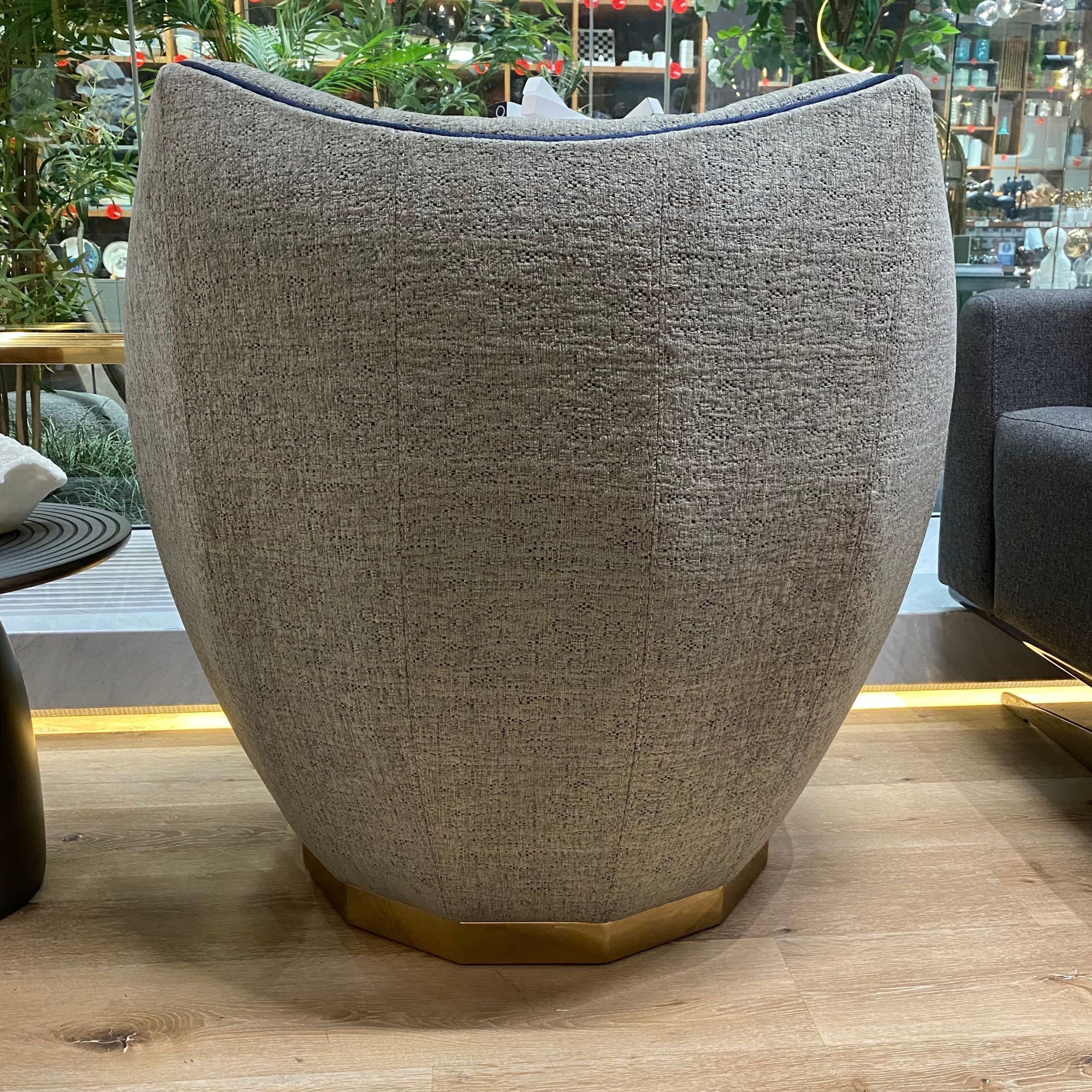 Display of Lisa Armchair Sofa by Nills Furniture Design, featuring a modern upholstered armchair with sleek design and neutral fabric.