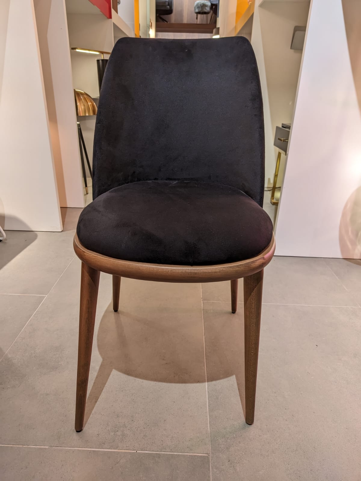 YOL LIVING Luna Dining Chair display model with modern design, featuring a sleek frame and comfortable seating.