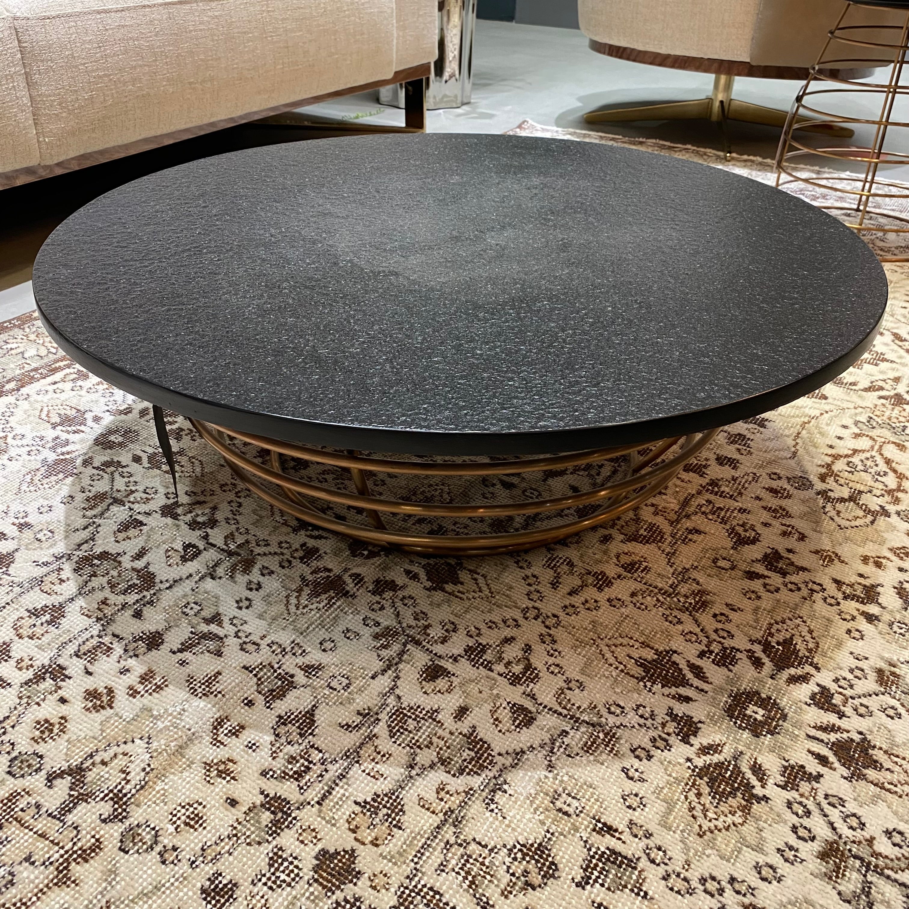 Display item featuring a natural Volakas stone table with elegant veining, crafted by BEACON, model LT009B-Nakheel.