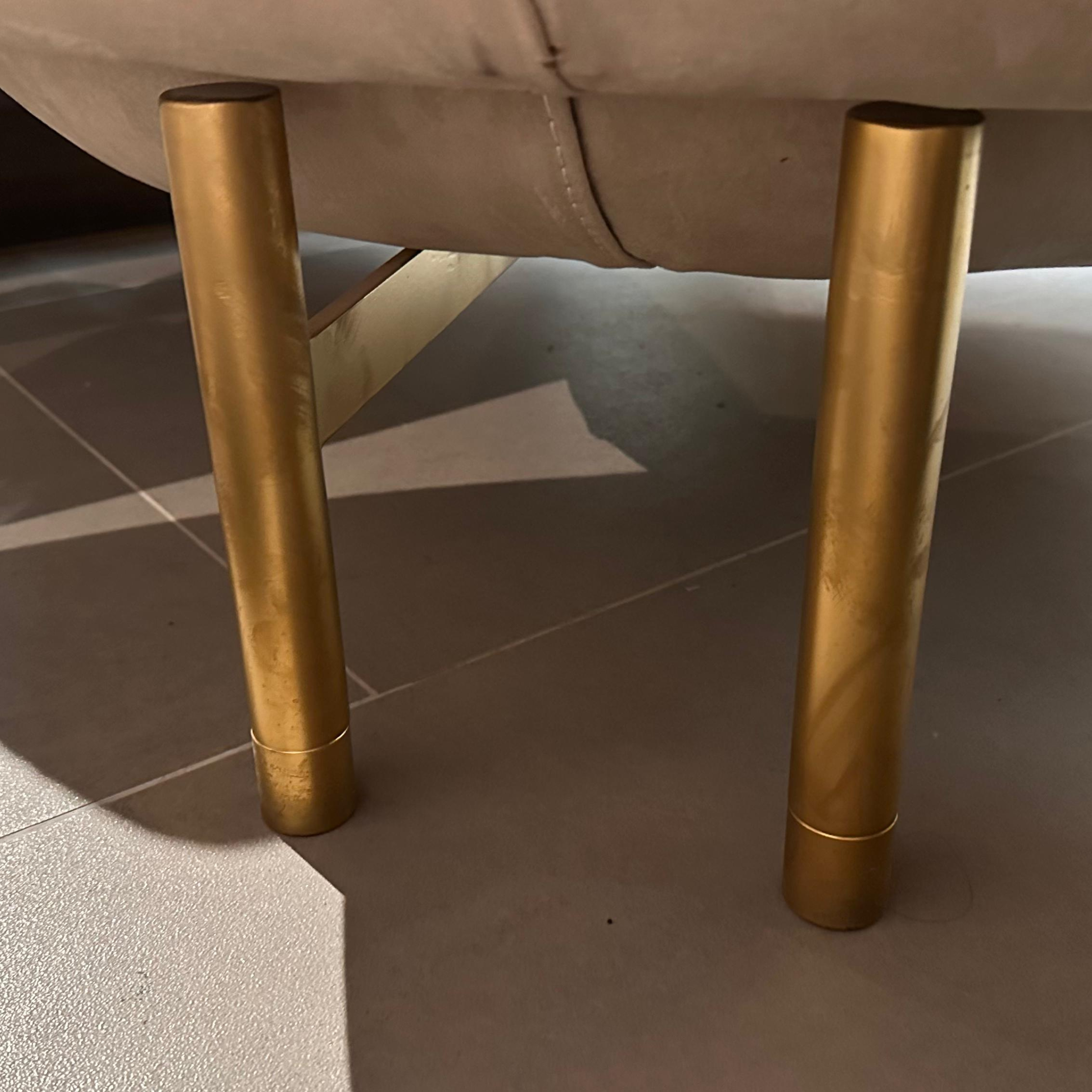 Display of the Next002 armchair by HOMAGE KOLTUK, showcasing its modern design and upholstered seating.