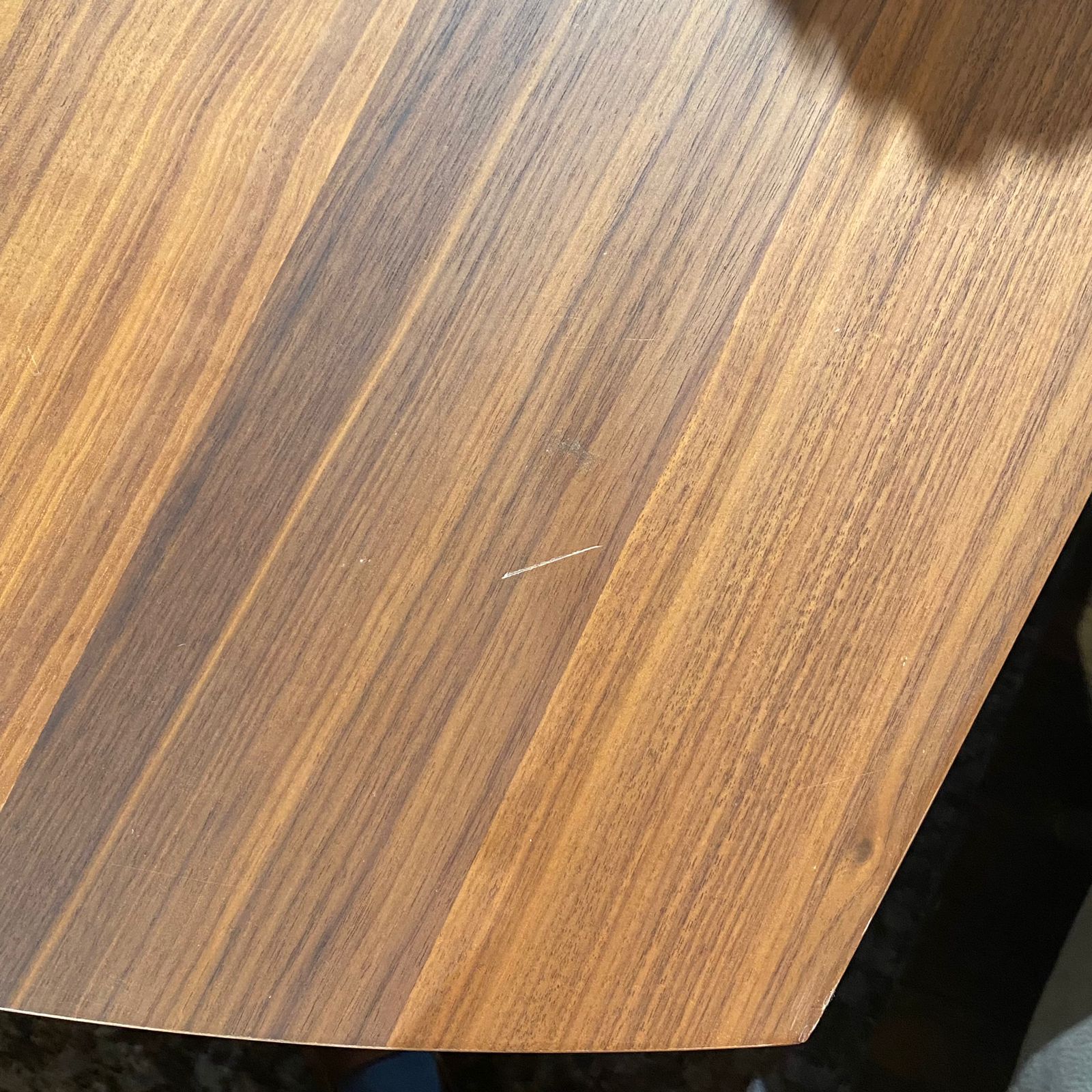Display of the HOMAGE KOLTUK Next007 dining table, showcasing its sleek wooden surface and modern design.