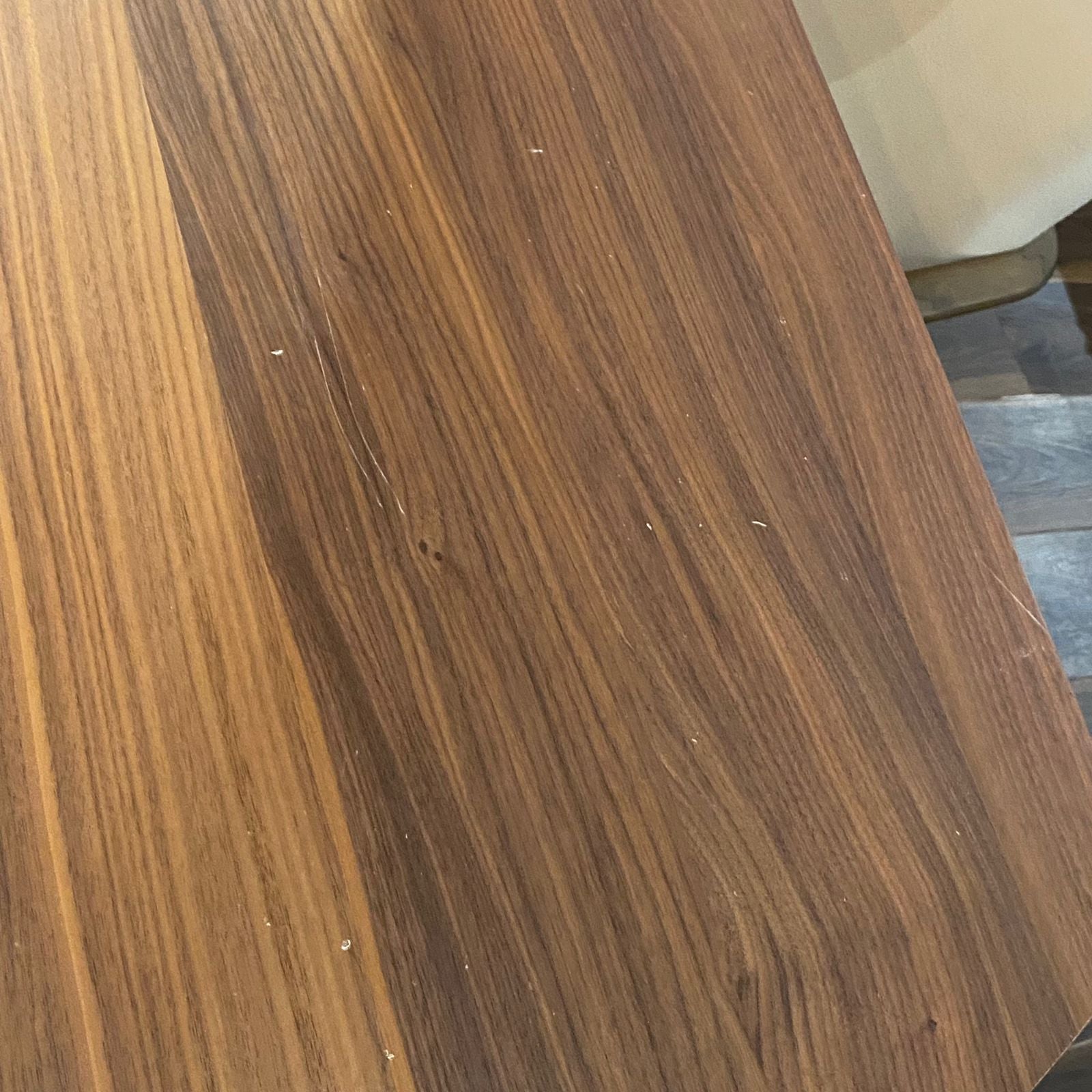 Display of the Next Dining Table Next007 by HOMAGE KOLTUK, showcasing the sleek wooden surface and modern design.