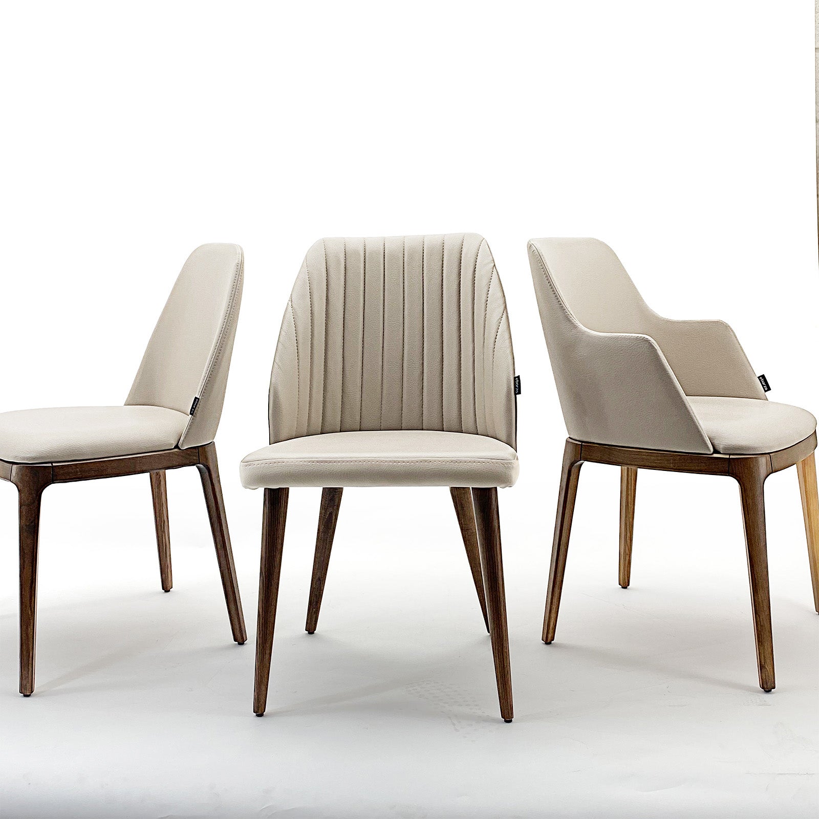 OZZO Nirvana solid ash wood chair without arms, displayed as a stylish, modern furniture piece with a sleek natural finish.