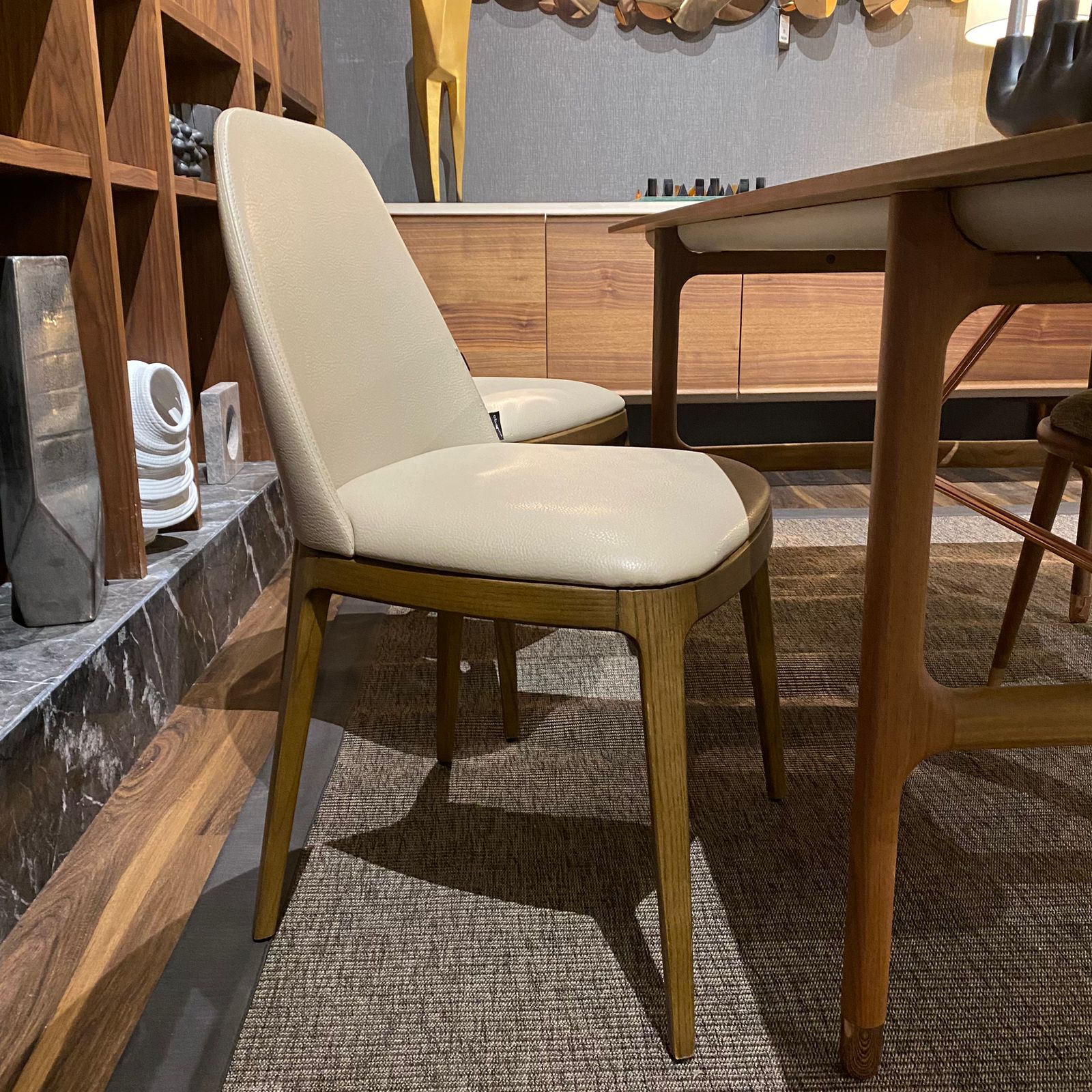 OZZO Nirvana solid ash wood chair without arms, display model showcasing modern wooden dining or accent chair design