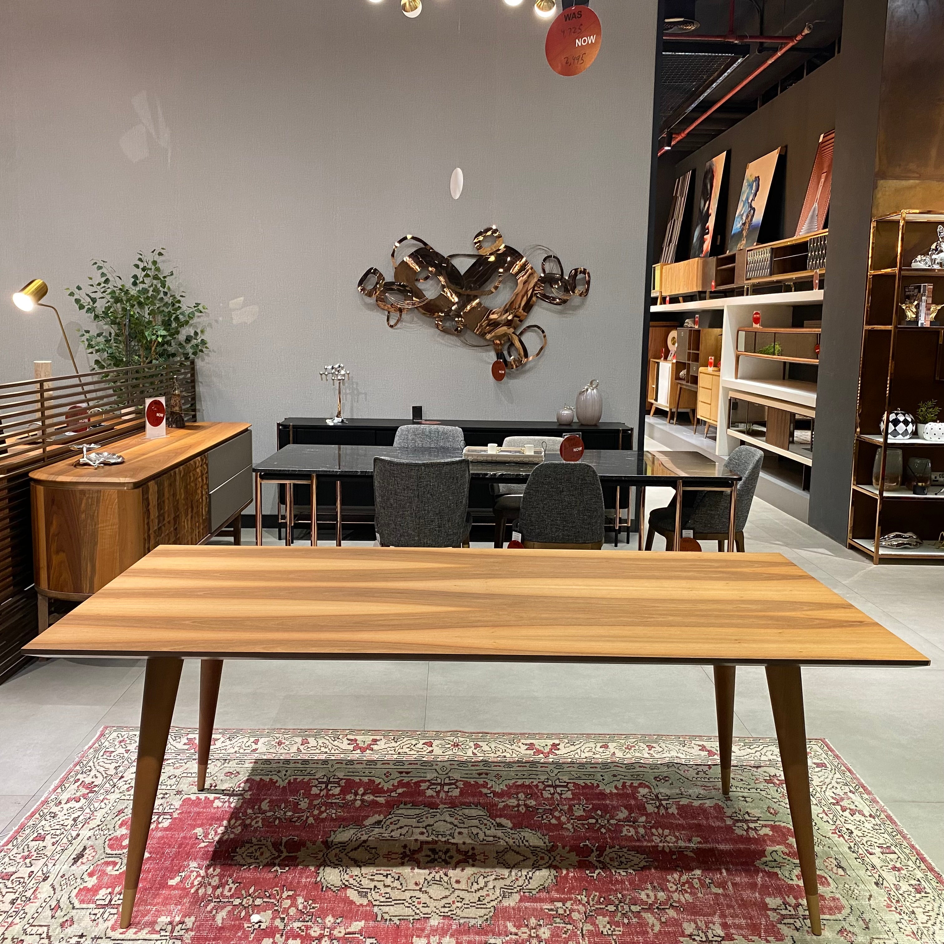 Display image of a Pena Dining Table by YOL LIVING, showcasing the modern wooden design on a clean, minimal background.