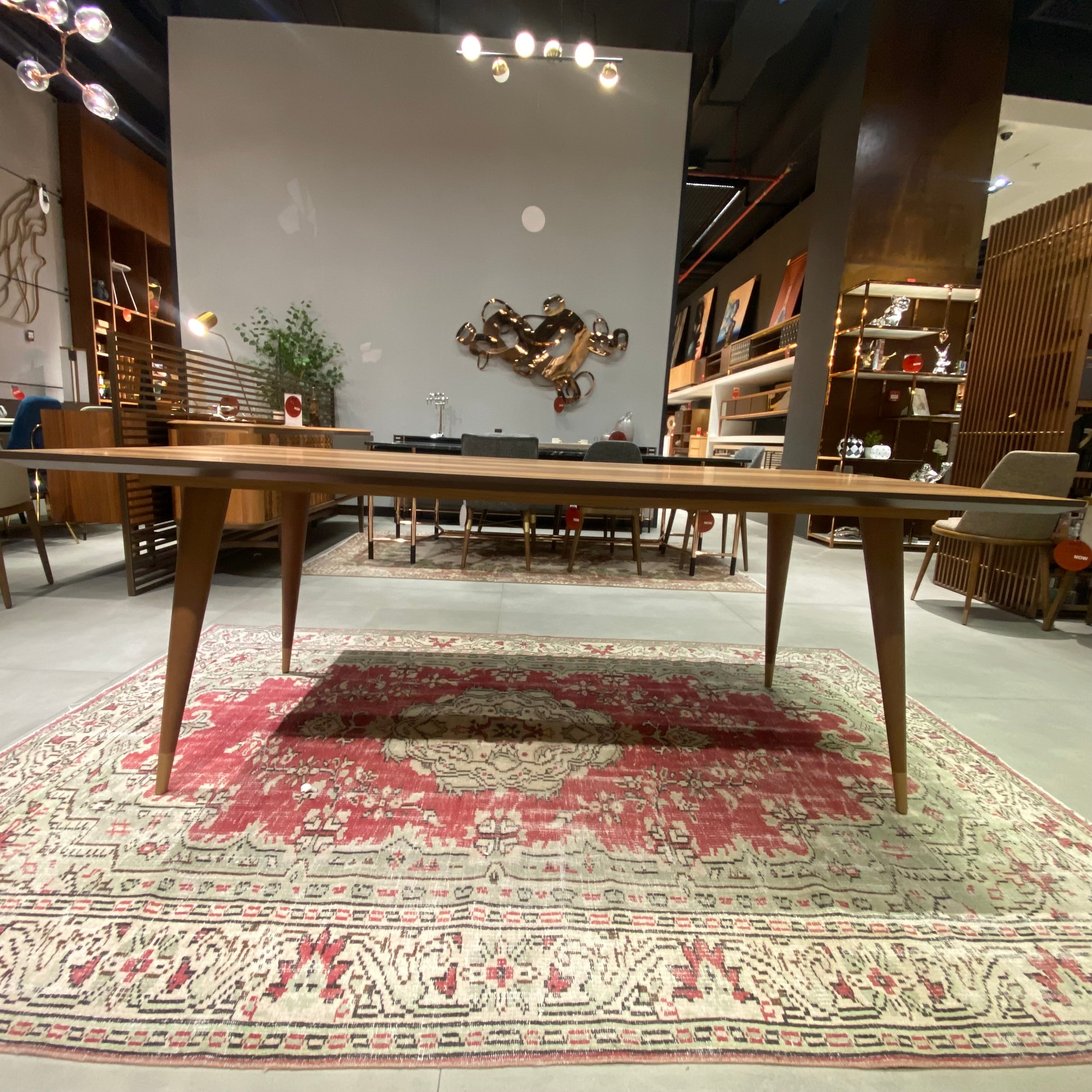 Display image of YOL LIVING Pena Dining Table, showcasing a modern wooden dining table with a smooth surface and sleek design.