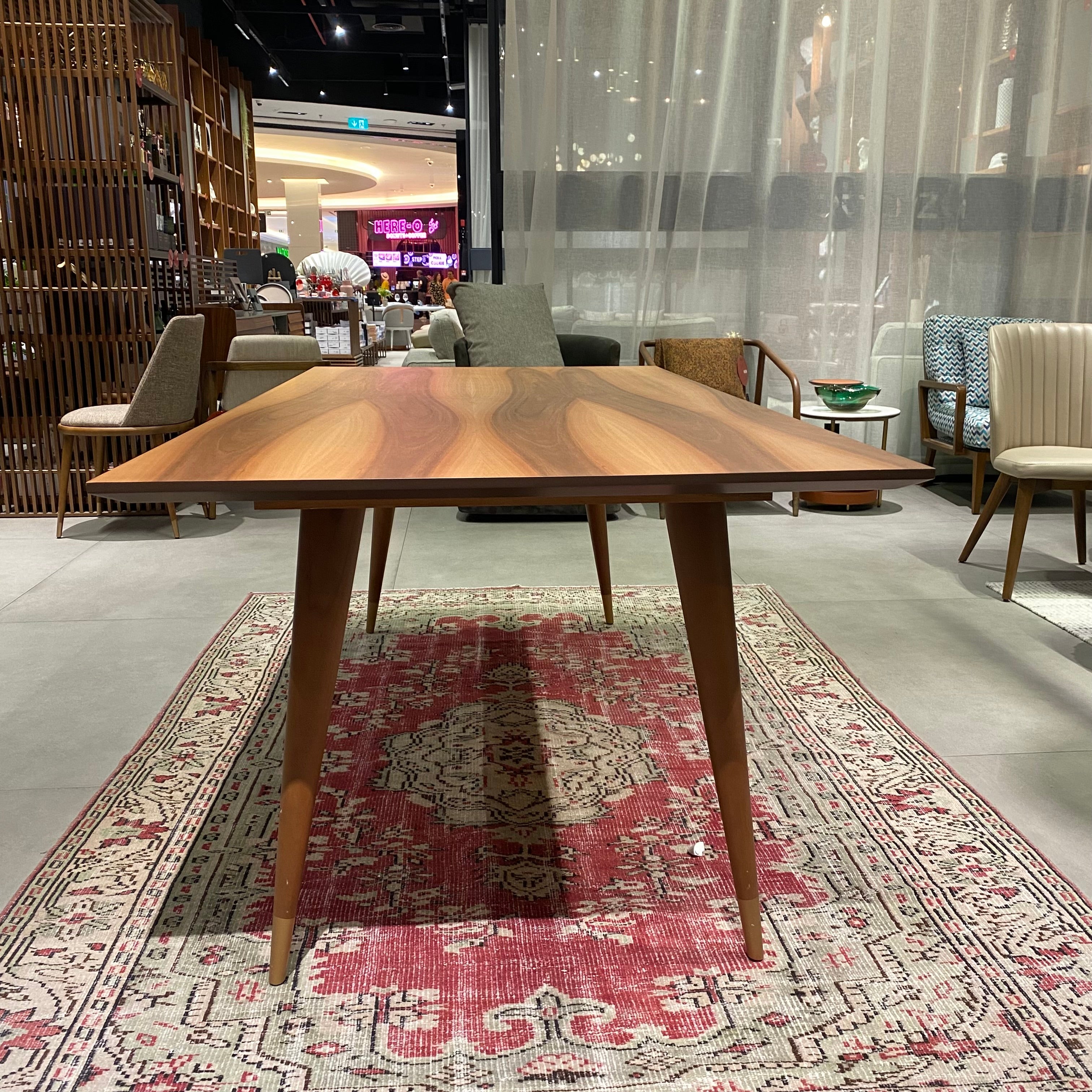 Display image of YOL LIVING Pena dining table, modern wooden table with sleek design, perfect for contemporary dining spaces.