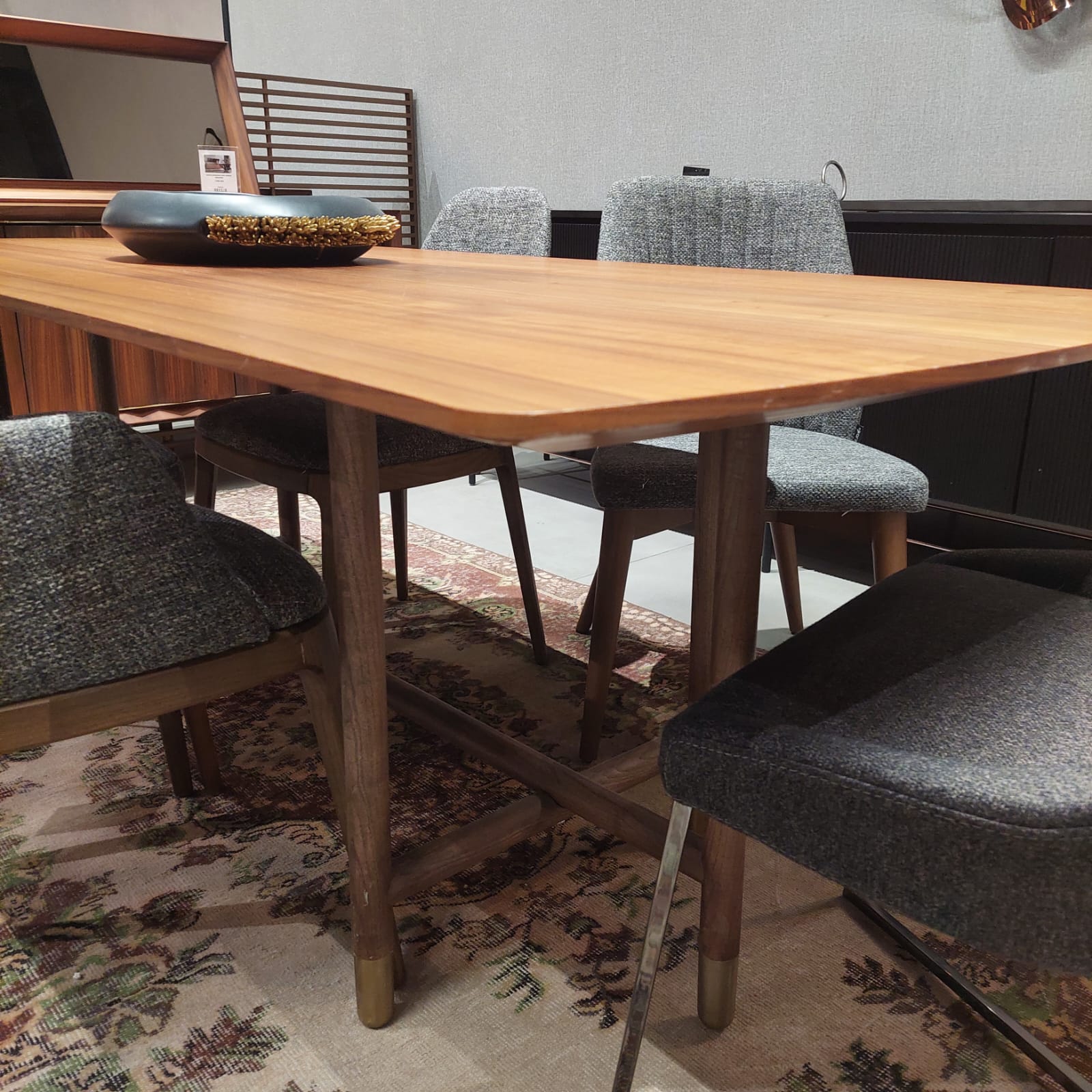 Display image of the Pietra Dining Table by HOMAGE KOLTUK, showcasing its modern design and wooden finish.