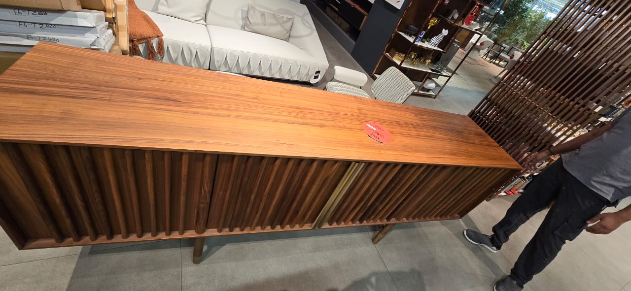 Display image of HOMAGE KOLTUK Pietra Side Board in modern wood finish, showcasing its sleek design and storage compartments.