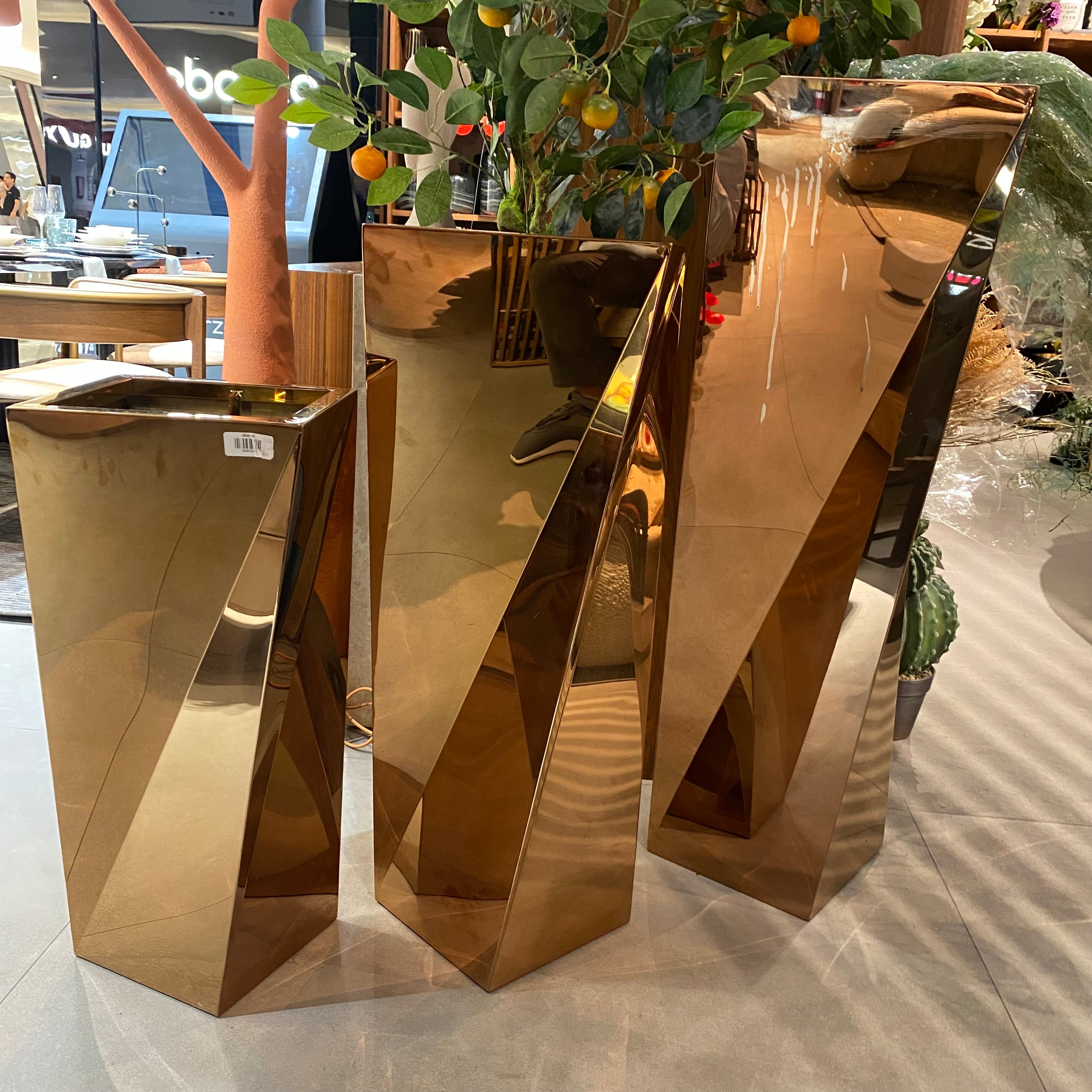 Set of 3 large stainless steel planter boxes by Beacon, featuring sleek, modern design for indoor or outdoor plant display.