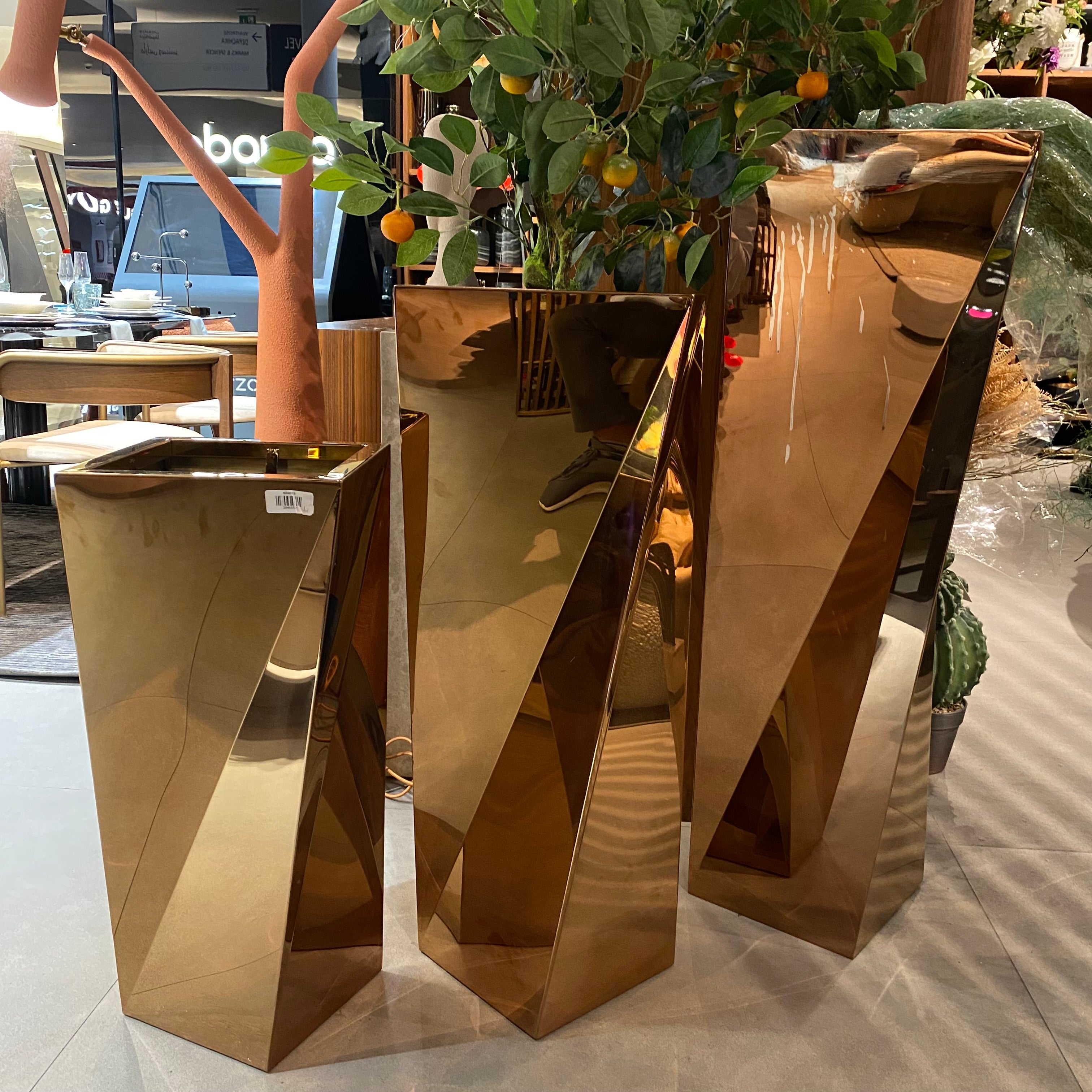 Set of 3 large stainless steel planter boxes by Beacon, featuring sleek modern design for indoor or outdoor decoration.