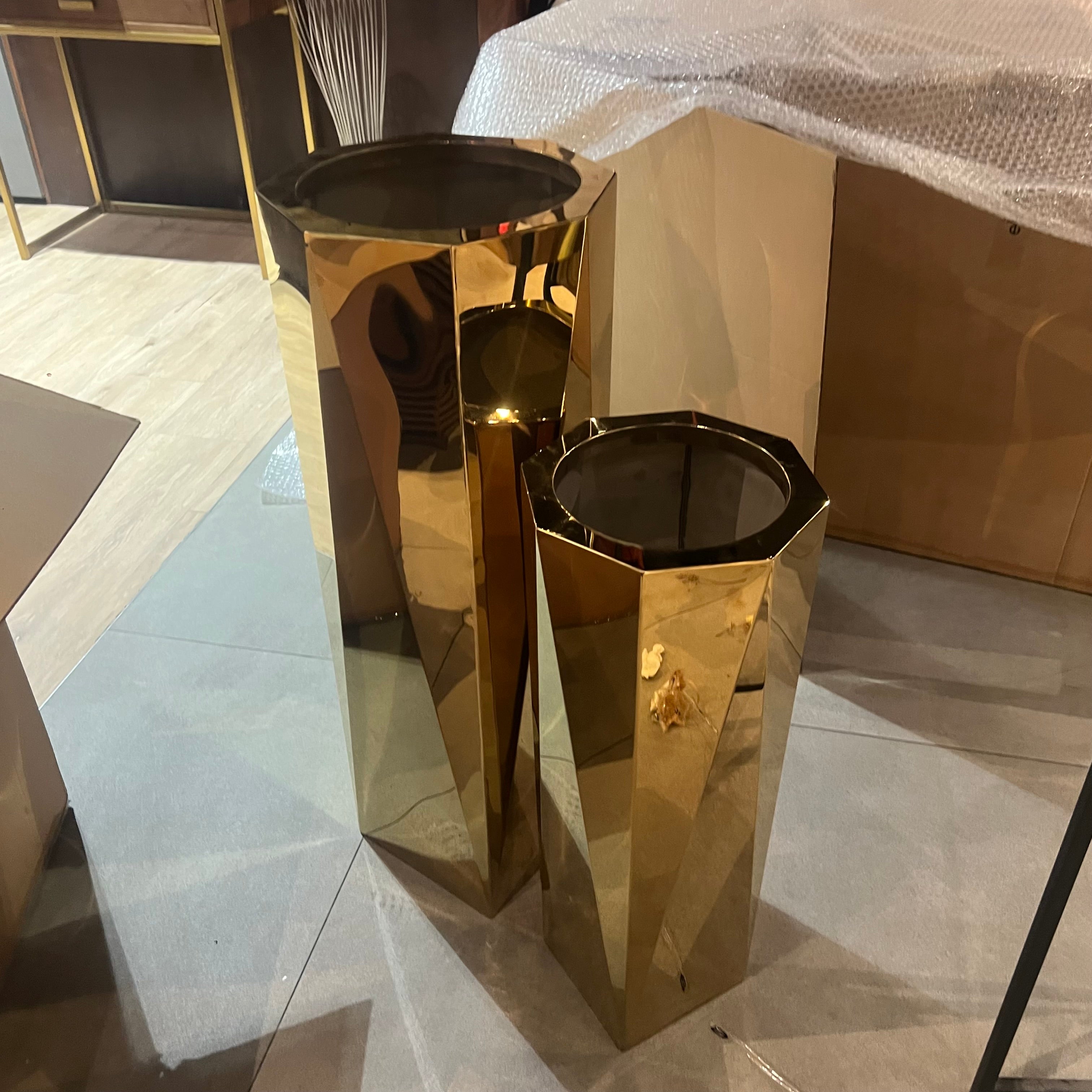 Set of 3 large stainless steel planter boxes by Beacon, displayed together with sleek, modern design for outdoor or indoor use.