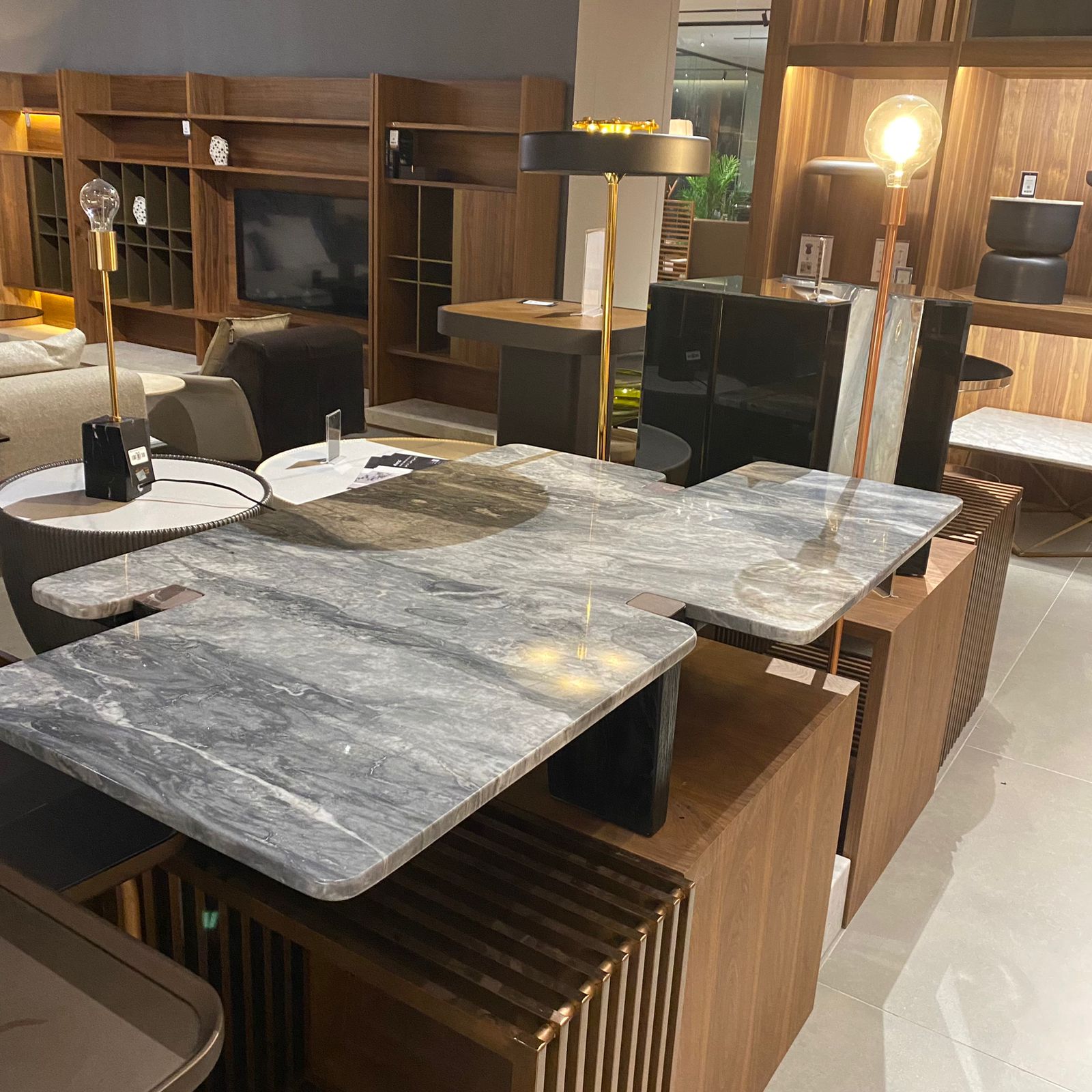 A2STONE Silvia center table with a sleek modern design, featuring a smooth surface and sturdy legs in a display setup.