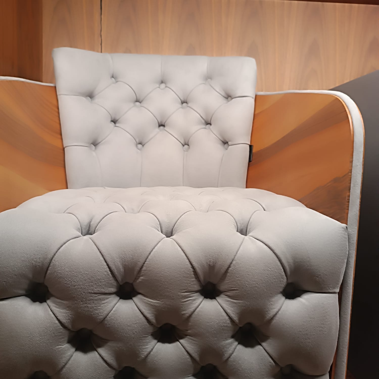 Small beige Sir Armchair display model from LODA FURNITURE, showcasing a stylish and comfortable seating option with modern design.