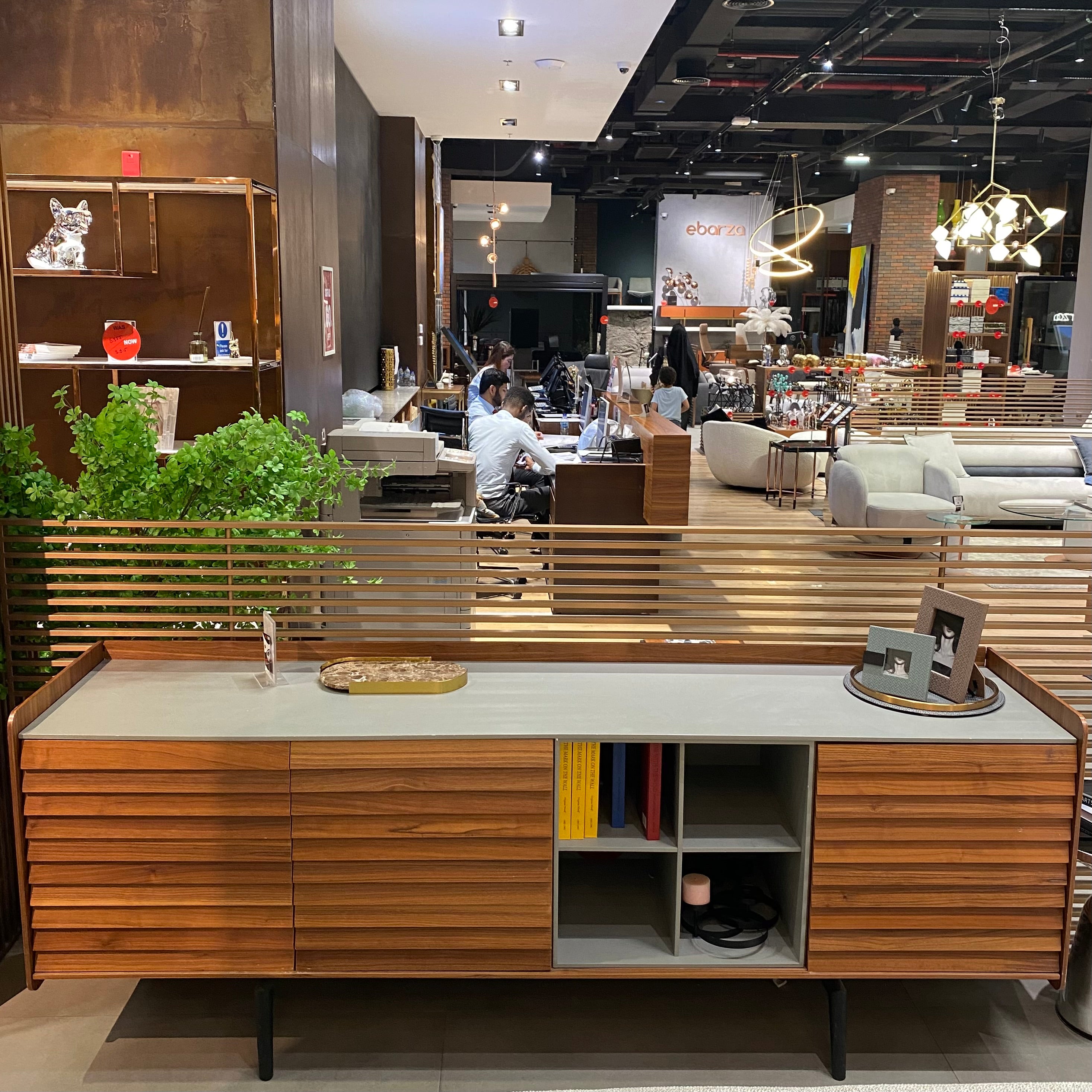 HOMAGE KOLTUK Solo Sideboard Solo004Nakheel display item with sleek wooden finish and modern design, showcasing storage compartments.
