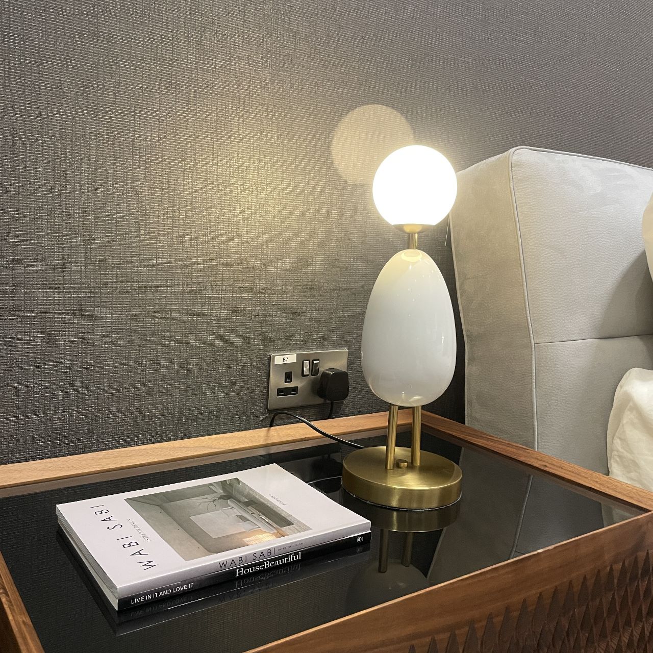White BEACON desk table lamp CY-LTD-1011-W with a sleek modern design, shown on a display table.