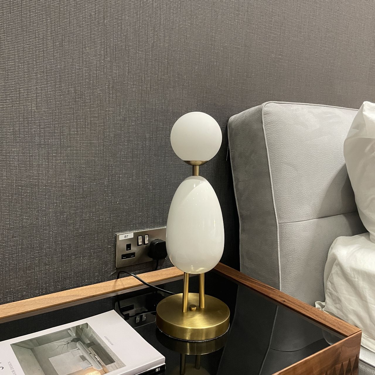 White BEACON desk table lamp model CY-LTD-1011-W with a modern design, shown on a display table.