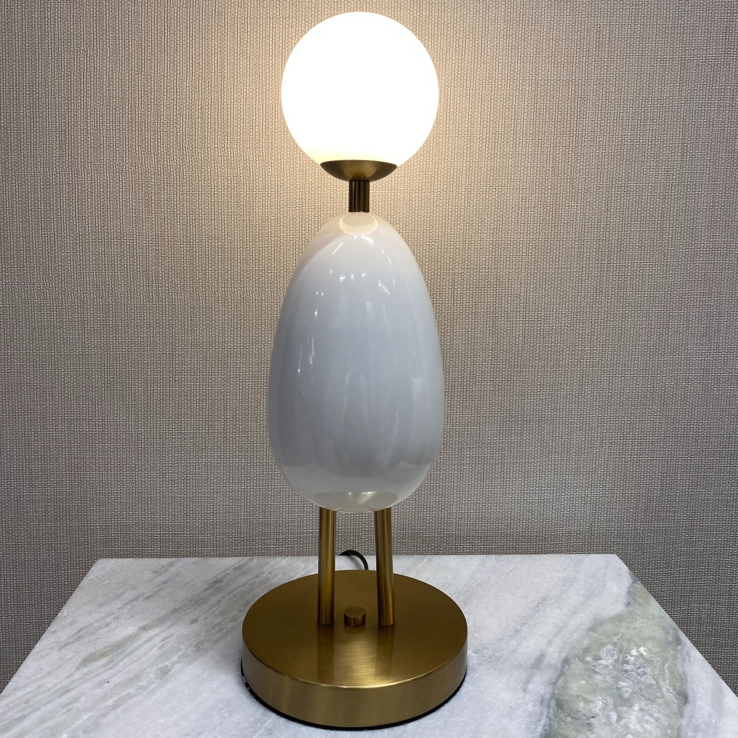 White BEACON desk table lamp CY-LTD-1011-W with a sleek modern design, shown on a display table.