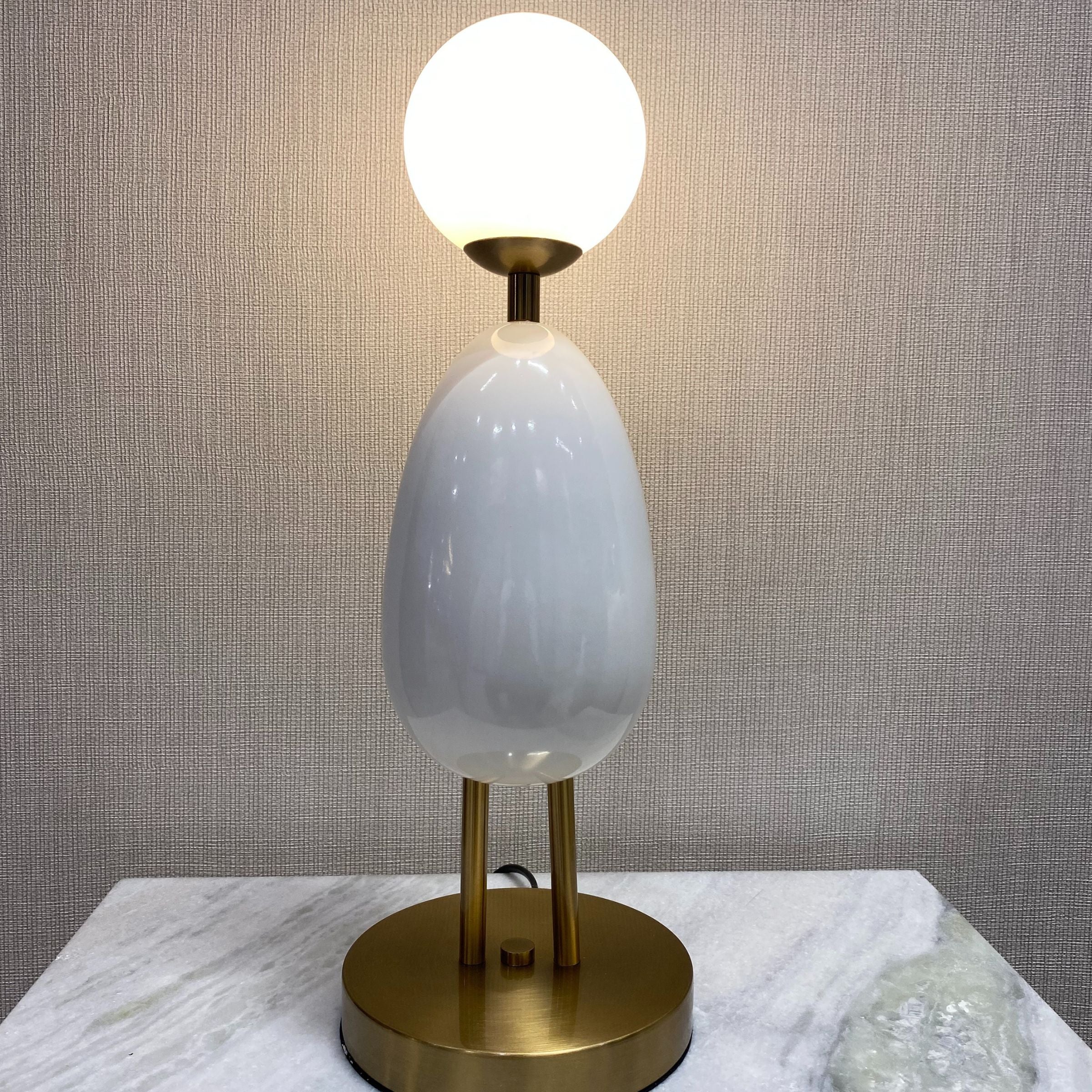White desk table lamp by BEACON, model CY-LTD-1011-W, featuring a sleek design suitable for modern home or office lighting.