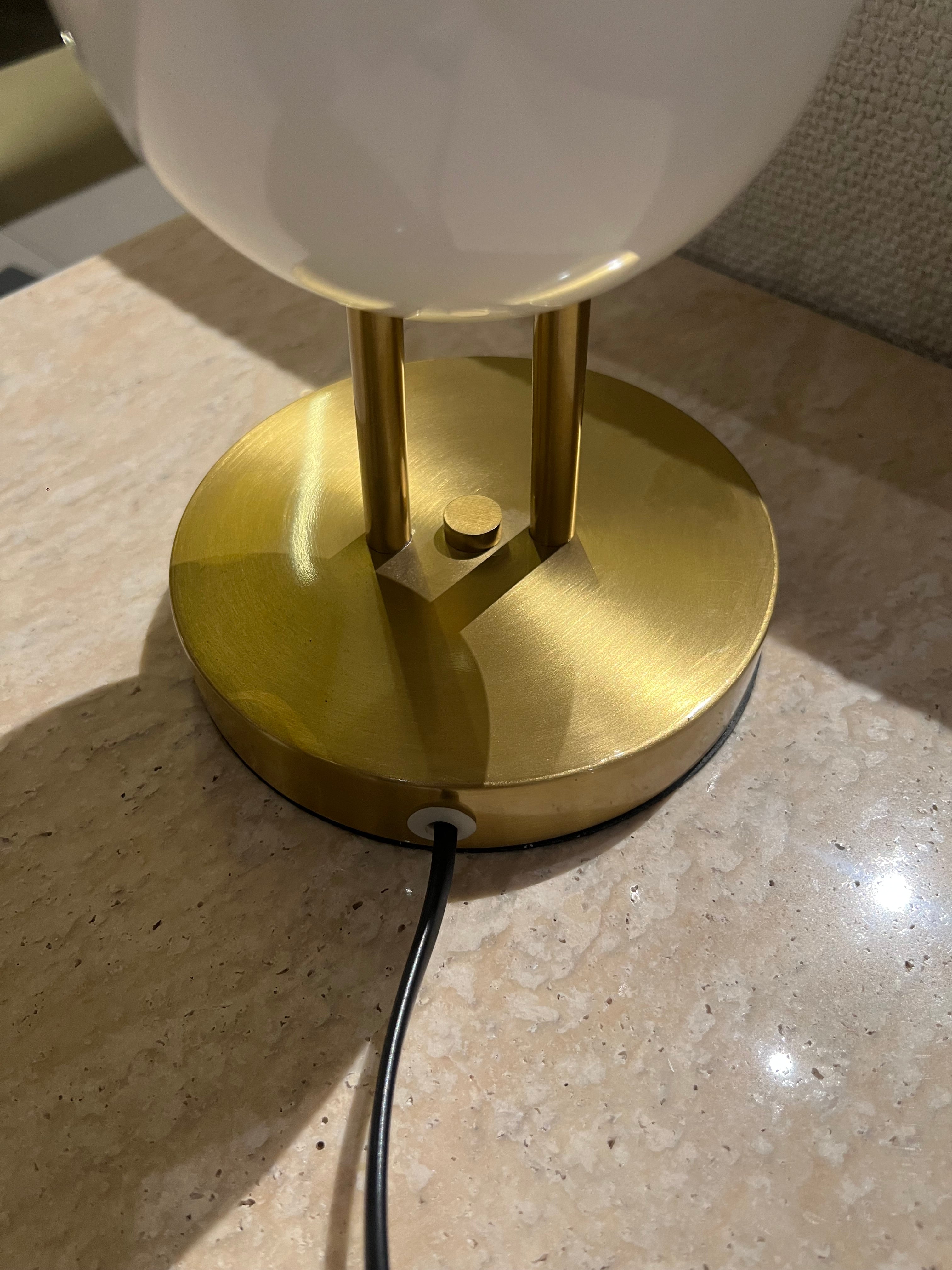 White table lamp from BEACON's Nakheel collection, displayed as a stylish home decor piece with modern design.