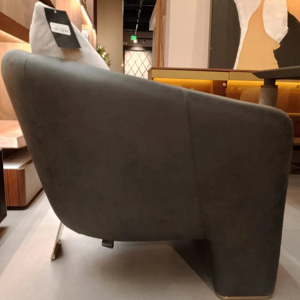Display of Tesla Armchair Tesla-001-YAS by SALONI, showcasing the modern design and plush upholstery of the lounge chair.