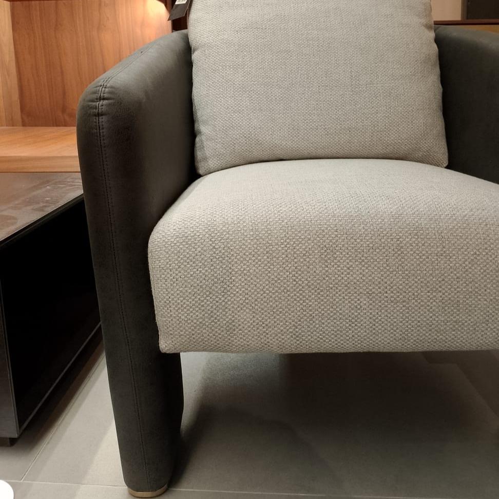 Saloni Tesla Armchair Tesla-001-YAS display model with sleek modern design and plush upholstery in a contemporary setting