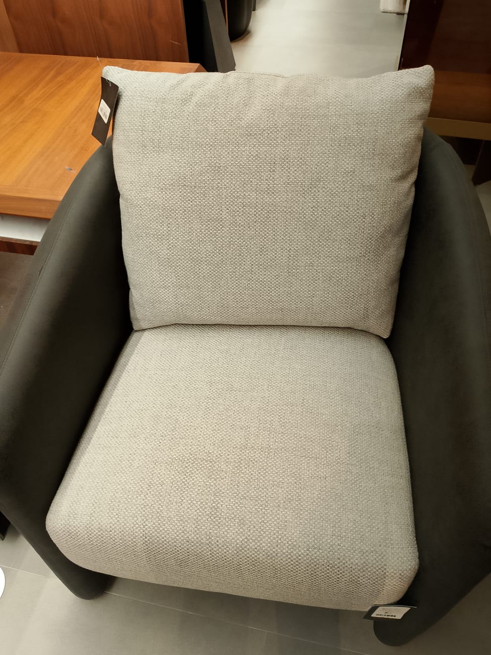 Tesla Armchair Tesla-001-YAS display item by SALONI, showcasing a modern, stylish armchair with sleek design and neutral upholstery.