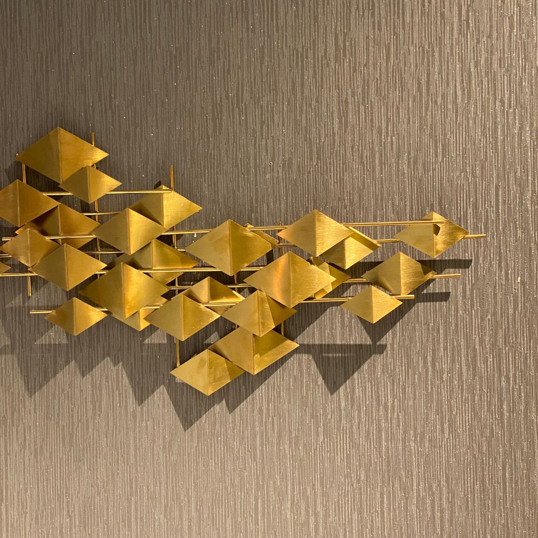 Handcrafted stainless steel artwork called The Flock by Beacon, displayed as a modern decorative piece with intricate design details.