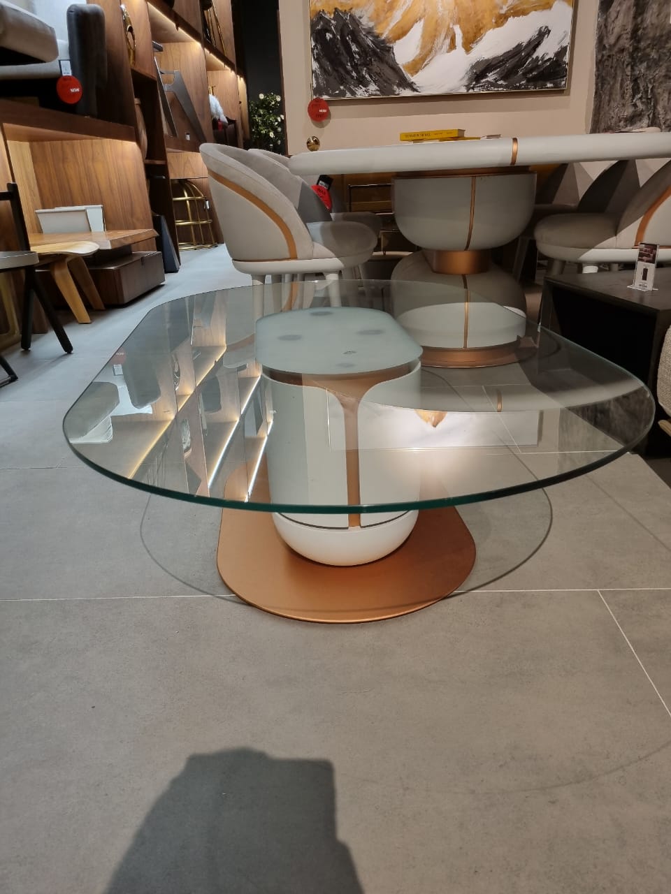 Display image of a modern Tulip coffee table by Loda Furniture with a sleek, rounded design and smooth white surface.